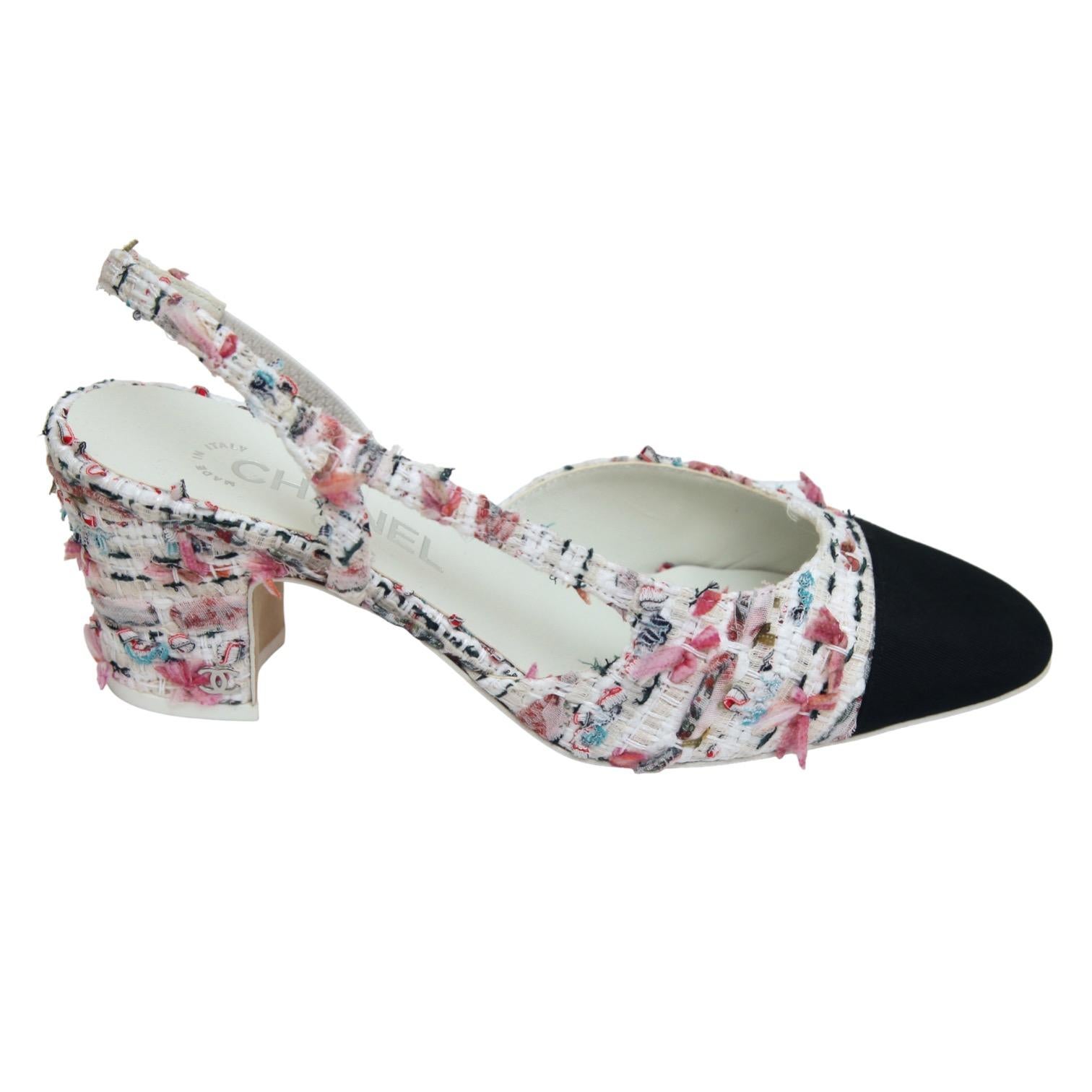 GUARANTEED AUTHENTIC CHANEL 2023 FANTASY TWEED SLINGBACK PUMPS

Details:
- White fantasy tweed slingback pumps with pink and red accents.
- Black grosgrain almond cap toe.
- Elasticized slingback.
- Leather insole and sole.
- Comes with designer