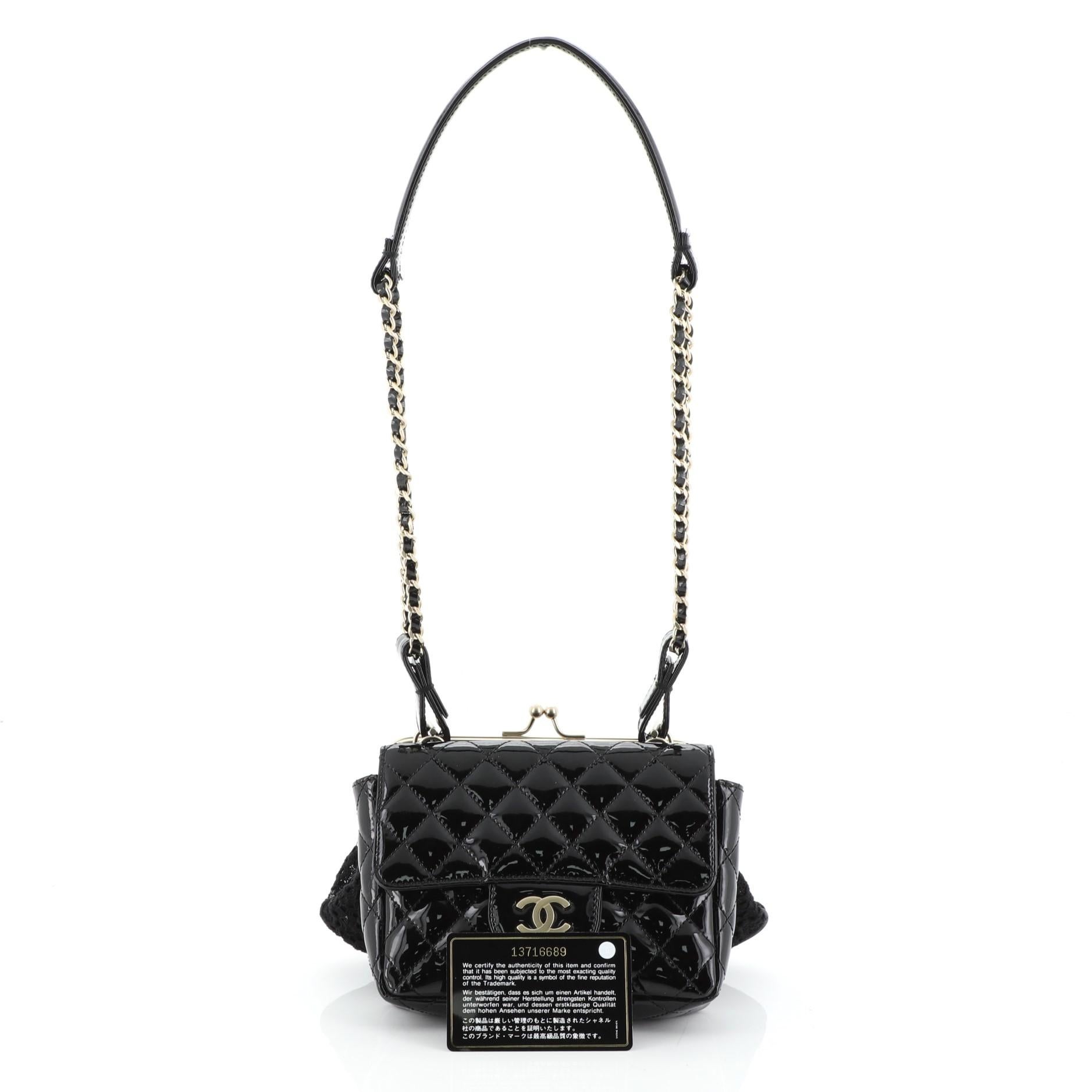 This Chanel Twin Chain Shoulder Bag Quilted Patent and Lace, crafted in black quilted patent leather and fabric, this unique twin bag features a connected flap and framed bag, woven-in leather chain strap with leather shoulder pad and matte