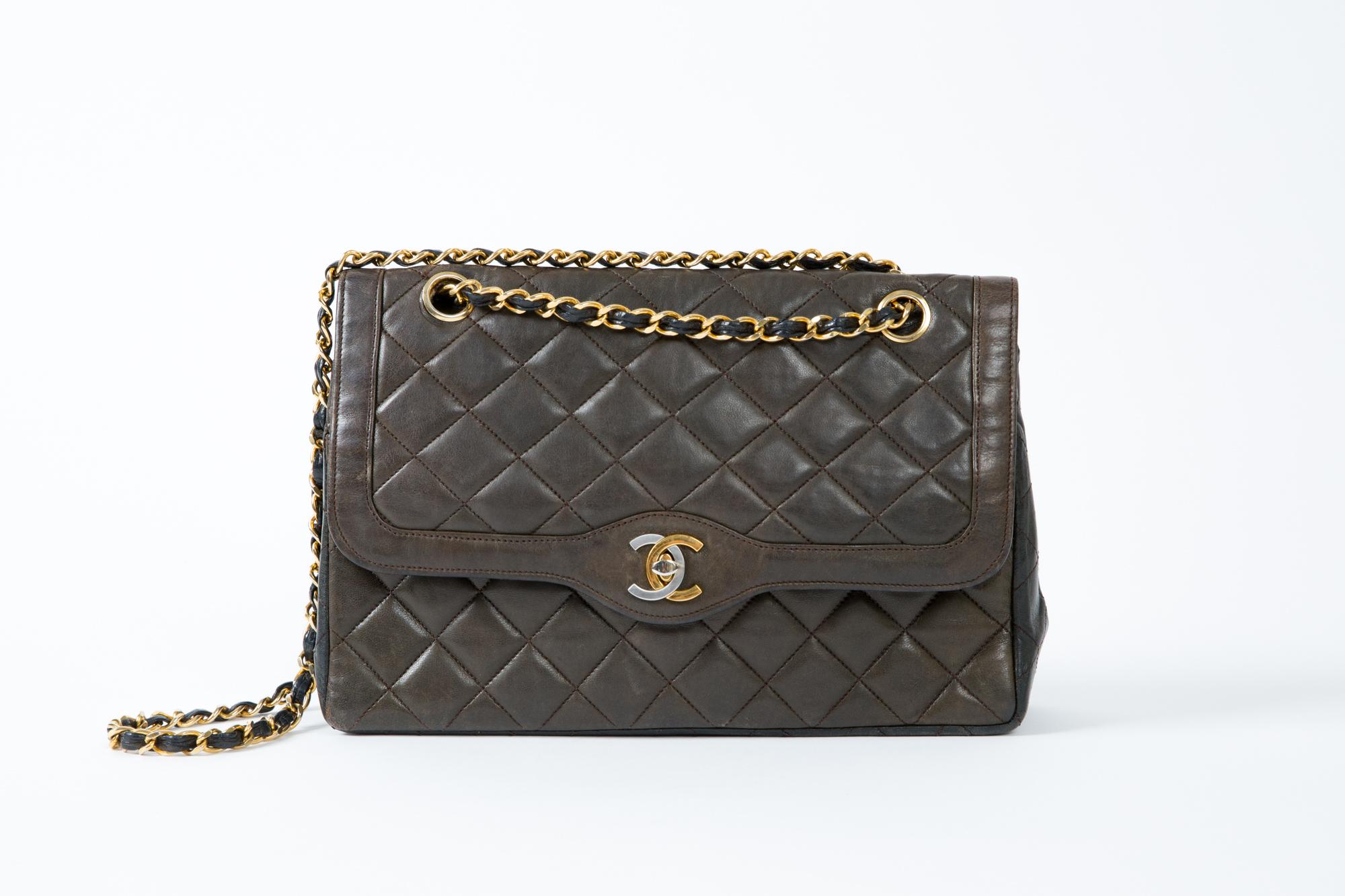 1980s chocolate and black two tones lambskin leather  Chanel Diana shoulder bag, Limited Edition double flap bag featuring a CC closure, Chanel CC turn lock in silver and gold metal opens to a double flap interior, one open pocket under the main