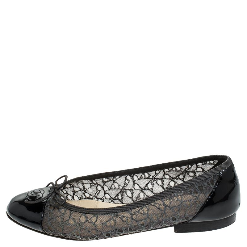 A common sight in the closets of fashionistas is a pair of Chanel ballet flats. They are perfect to wear on busy days and just stylish enough to assist one's style. These are crafted from grey lace and feature the CC logo on the black patent leather