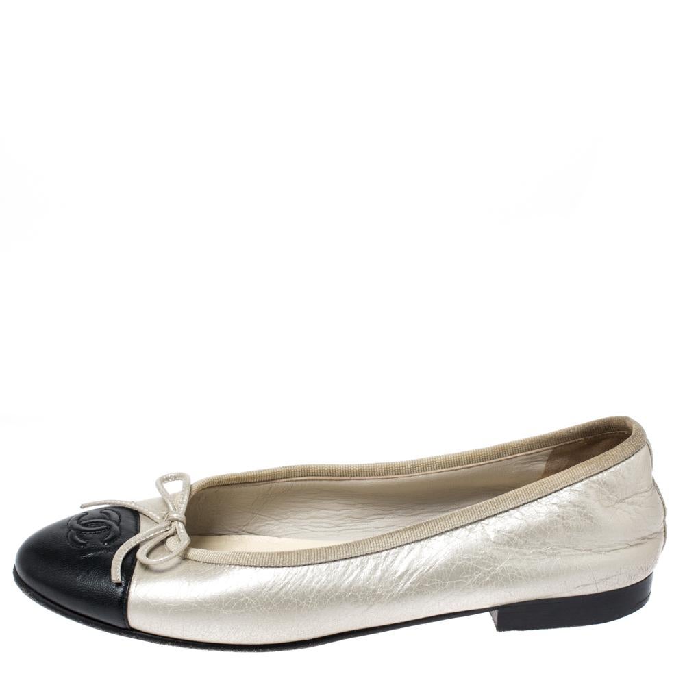 A common sight in the closets of fashionistas is a pair of Chanel ballet flats. They are perfect to wear on busy days and just stylish enough to assist one's style. These are crafted from two-toned leather and feature the CC logo on the embossed cap