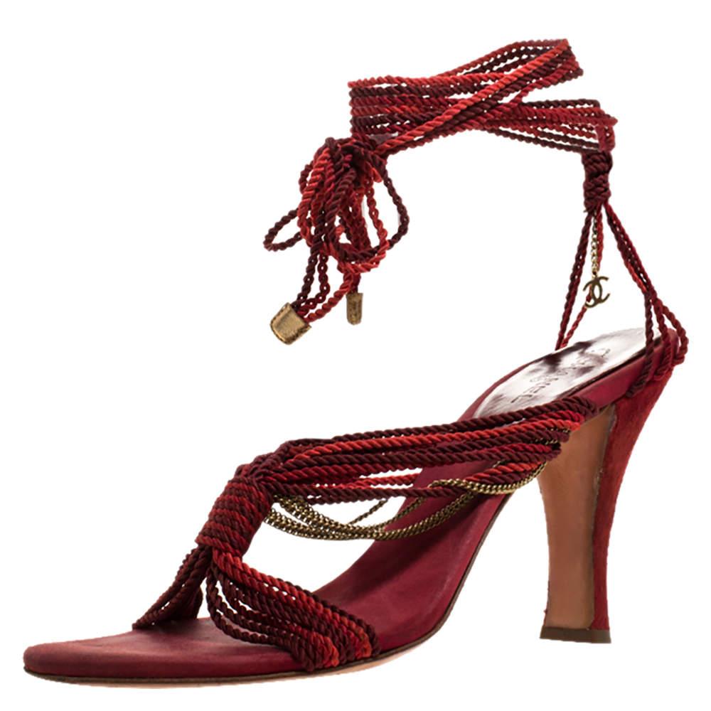 These sandals from the house of Chanel look right on style The sandals are crafted from two toned red velvet and designed with nylon ropes creating a smart silhouette coupled with metal chainlinks and tie ups at the ankles. Balanced on 10 cm heels 
