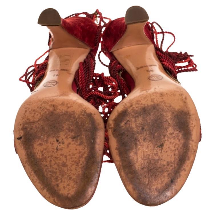 These sandals from the house of Chanel look right on style! The sandals are crafted from two-toned red velvet and designed with nylon ropes creating a smart silhouette coupled with metal chainlinks and tie-ups at the ankles. Balanced on 10 cm heels,