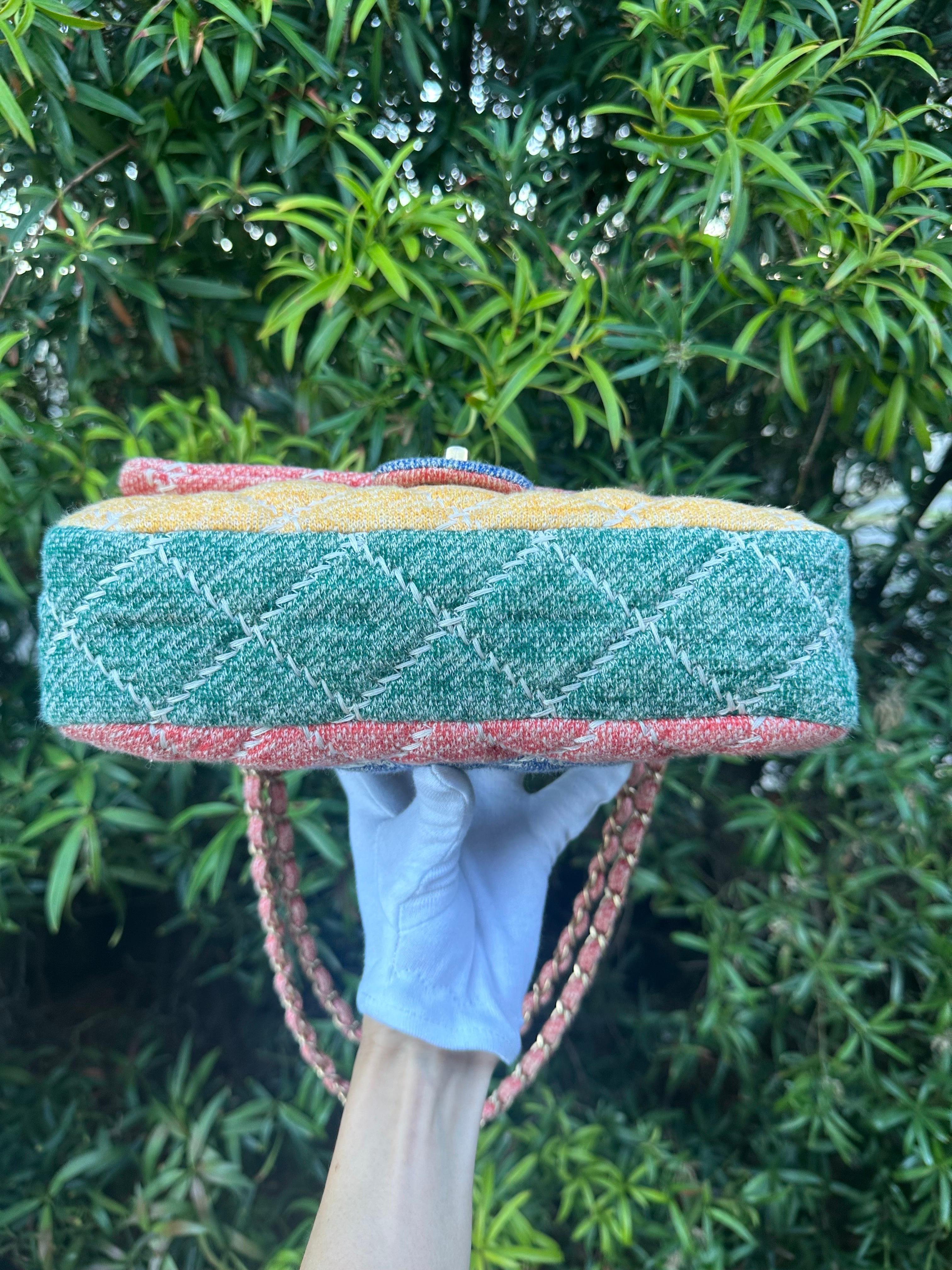 CHANEL Jersey Quilted Fabrics & Co Medium Flap. Greart for everyday use!

The bag is crafted of diamond quilted jersey knit fabric in pink and yellow, green on the sides and a blue rear patch pocket. There are light gold chain link shoulder straps