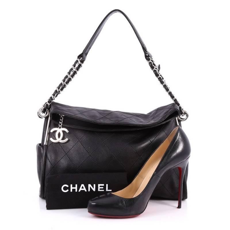 This authentic Chanel Ultimate Soft Hobo Leather Medium is elegant and alluring, appealing to the modern woman with its slouchy nature and chic design. Crafted in soft black quilted leather with a diamond design, this no-fuss hobo features two side