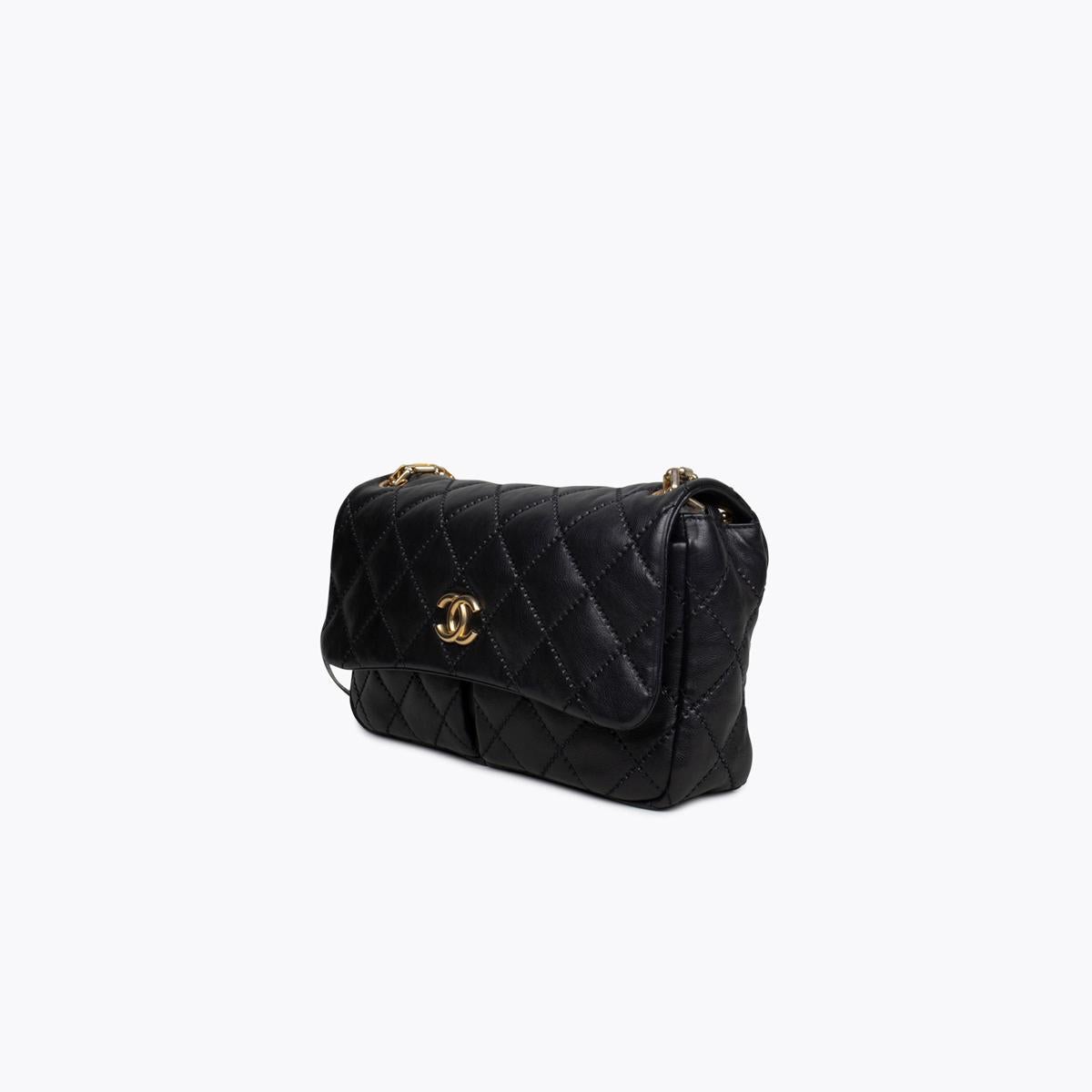 Black quilted leather Chanel Ultimate Stitch Retro Chain Flap Bag with

- Brushed gold-tone hardware
- Single convertible chain-link shoulder strap
- Creme woven lining
- Three interior pockets; one with zip closure and CC magnetic closure

Overall