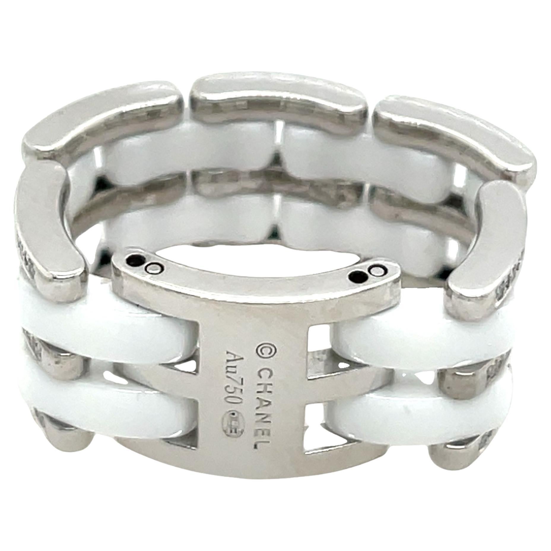 An exquisite CHANEL Ultra Ring (Large Version), crafted in 18ct white gold and featuring a bracelet link-style design. This luxurious piece showcases a double row of white ceramic and a triple row of dazzling natural diamonds, embodying CHANEL’s