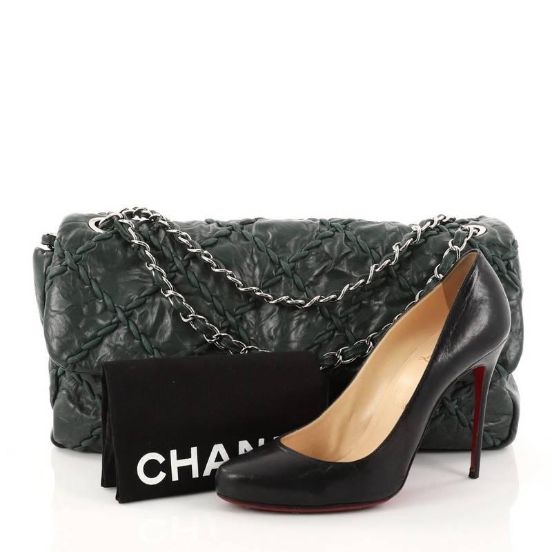 This authentic Chanel Ultra Stitch Flap Bag Quilted Calfskin Jumbo, presented in the brand's 2010 Collection, is a funky, modern twist on its classic design made for modern fashionistas. Crafted from green quilted calfskin leather, this subtly