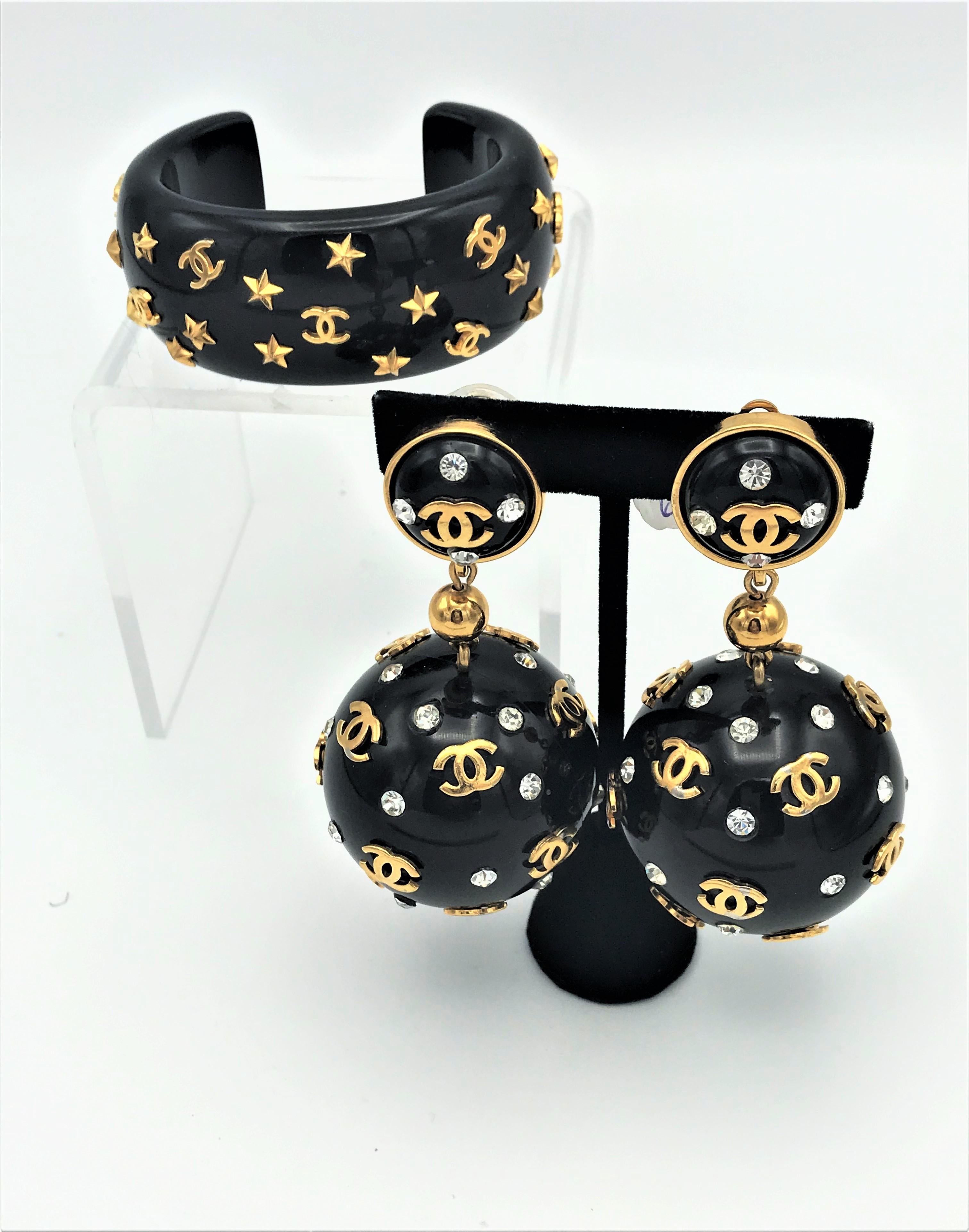 Unique Vintage Chanel black big ball clip on earrings, plastic 1970s with gold 1