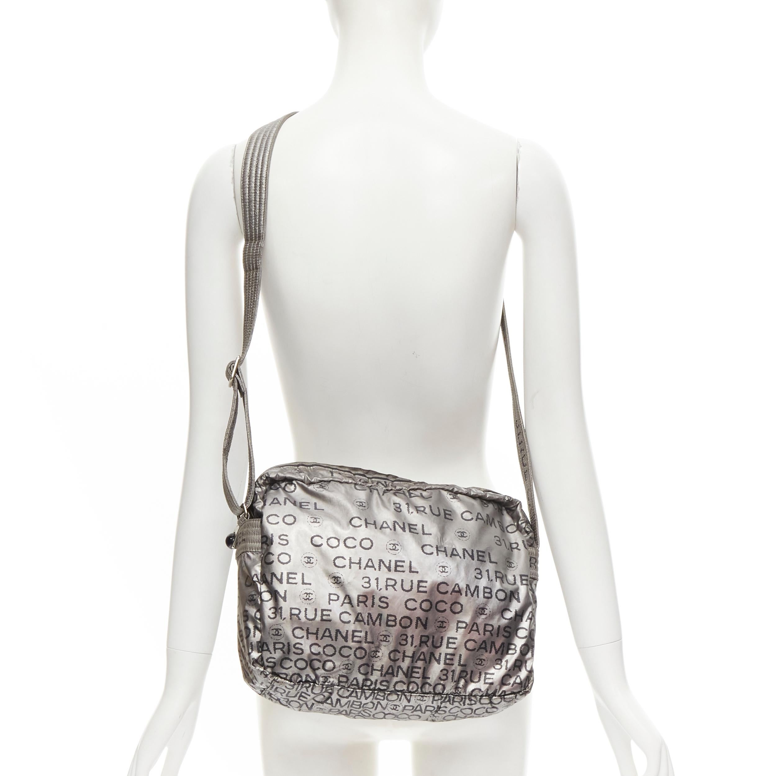 CHANEL Unlimited Ligne silver black logo print crossbody weekender bag 
Reference: KNCN/A00029 
Brand: Chanel 
Designer: Karl Lagerfeld
Collection: Unlimited Ligne 
Material: Nylon 
Color: Silver 
Pattern: Solid 
Closure: Zip 
Extra Detail: Chanel