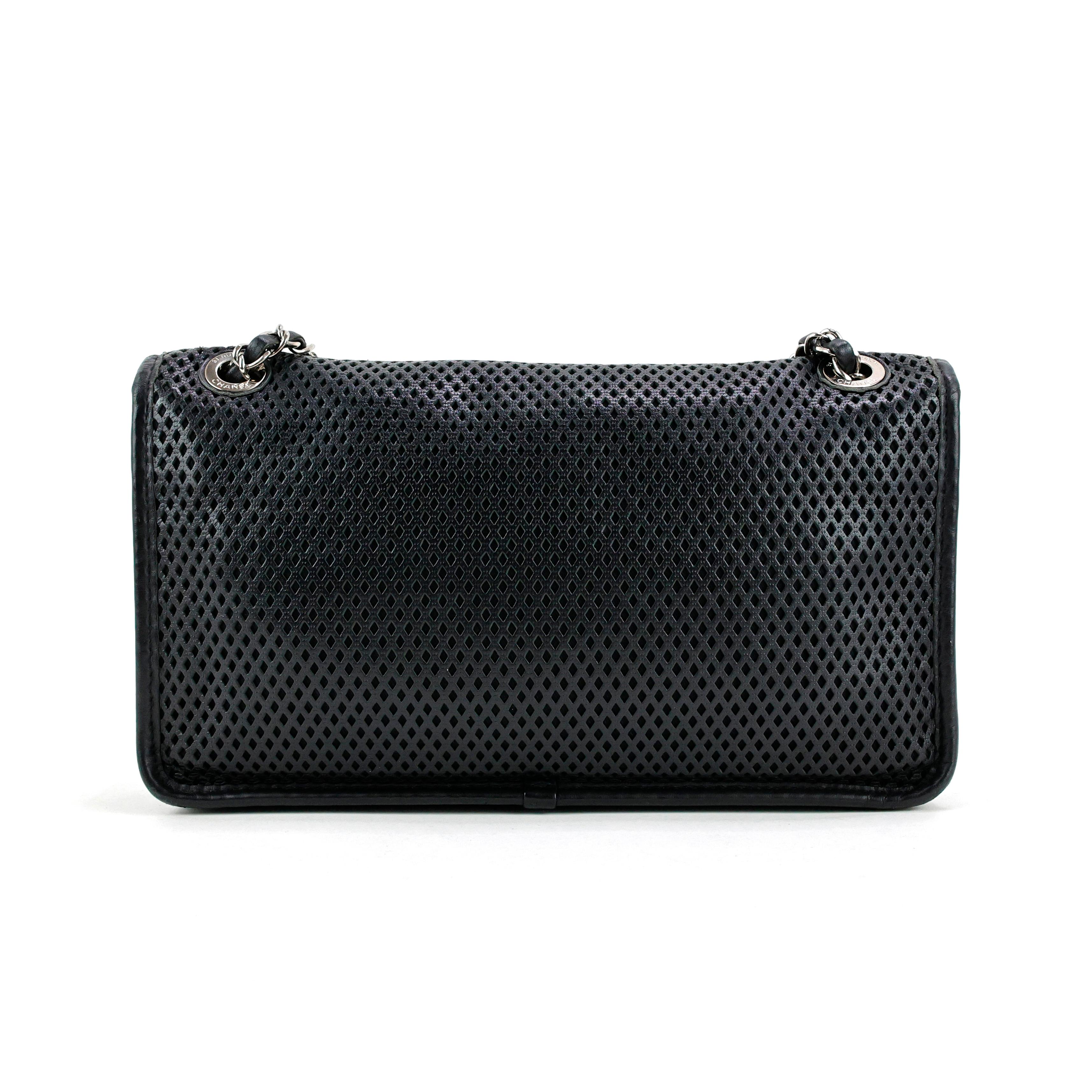 Chanel Up In The Air Perforated CC leather Flap Bag, color black, silver hardware.

Measurements:
29,5cm x 19cm x 6cm 