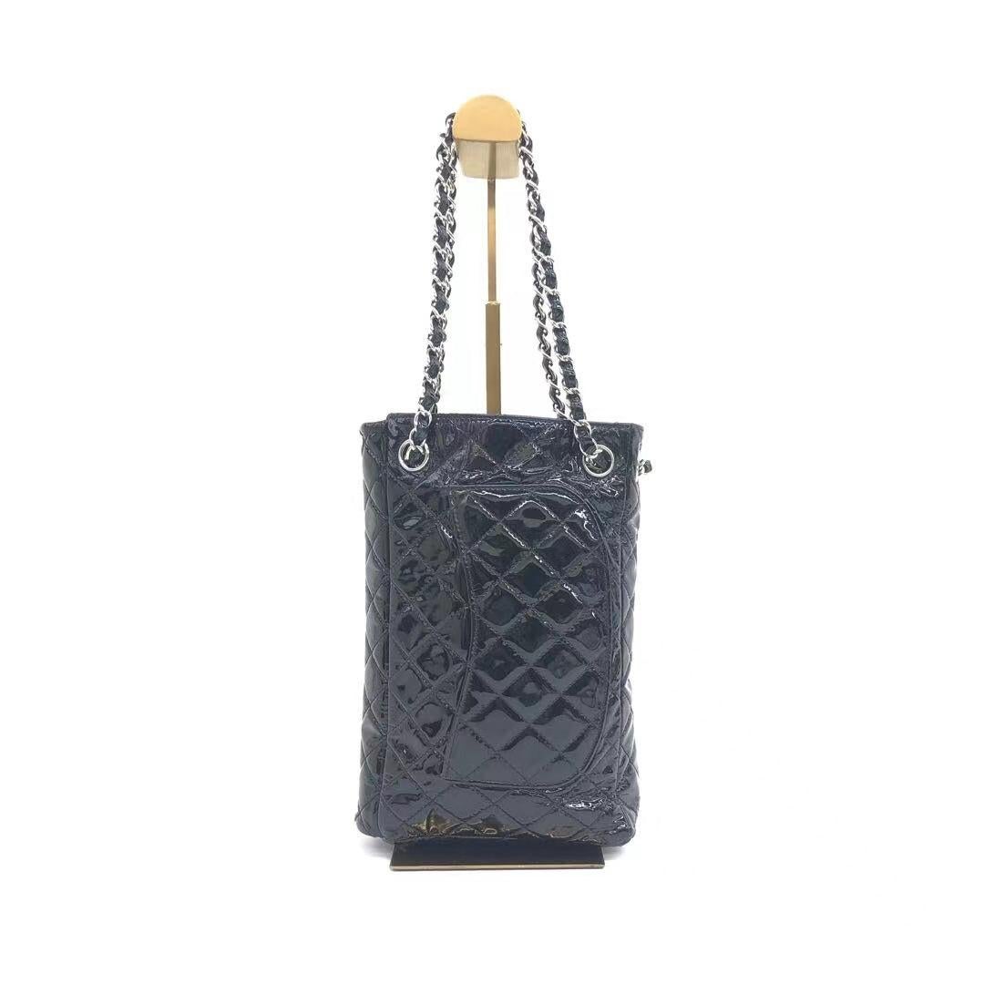 Chanel Upside Down Flap Bag Black Diamond Quilted Patent Leather Silver Hardware
These are professional photos of the actual bag.
  This genuine Chanel Upside Down Flap Bag in Black Diamond Quilted Patent Leather Silver Hardware, released in