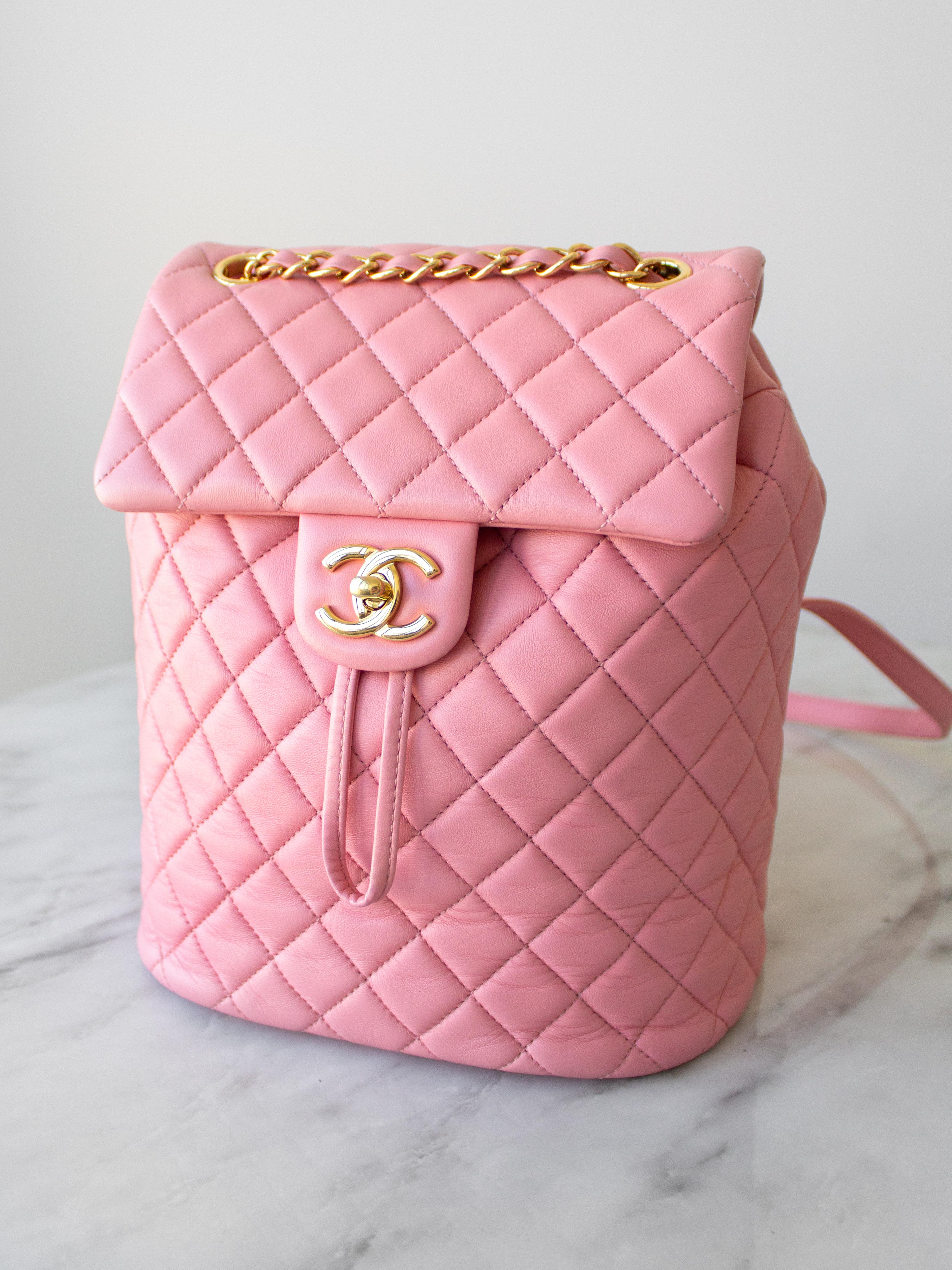 The Chanel Small Urban Spirit Backpack is a truly beautiful piece of craftsmanship. This stylish and luxe backpack is crafted from soft and smooth diamond-quilted leather in bubble gum pink color and features polished gold chain link leather