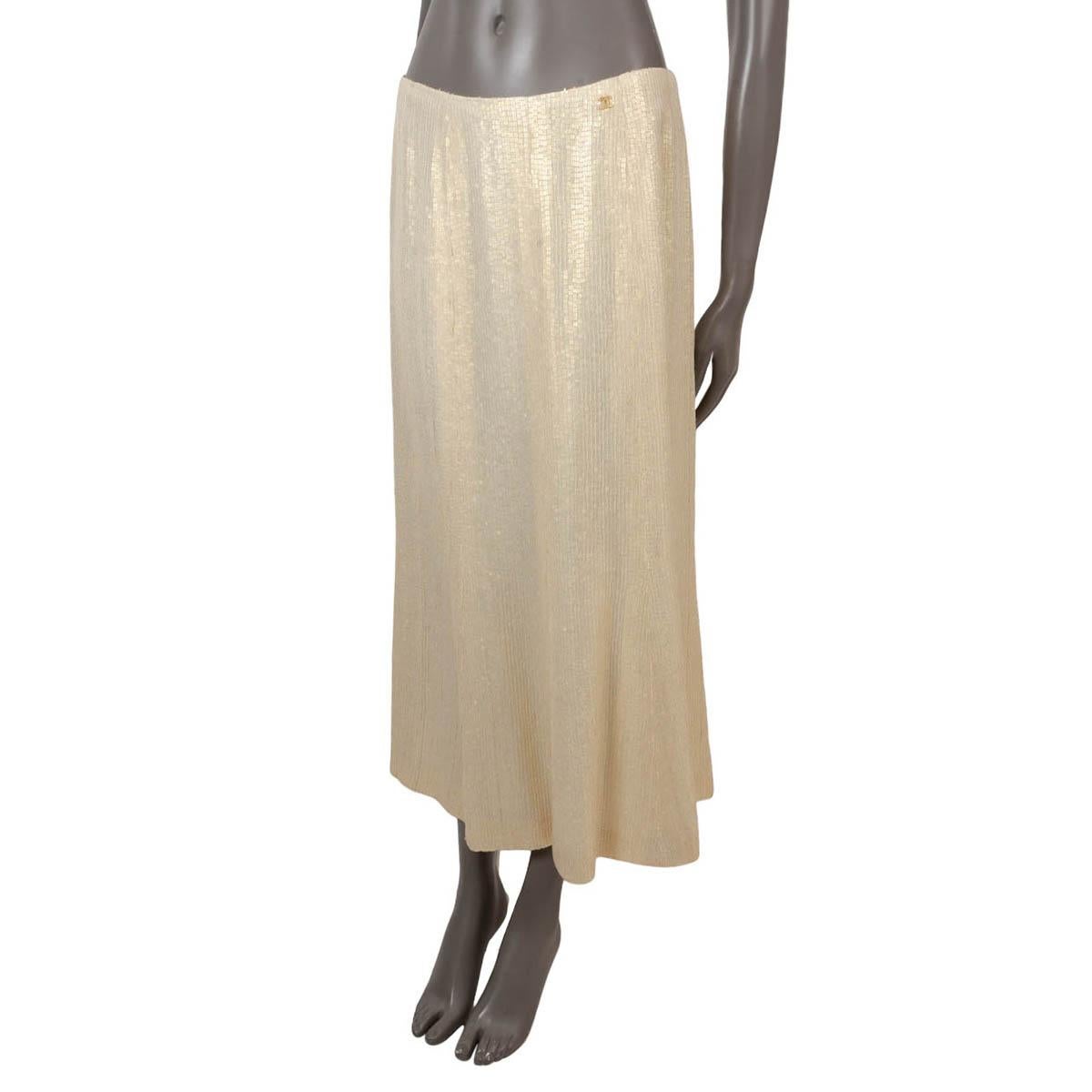 100% authentic Chanel sequin midi skirt in vanilla silk (100%). Features square sequins through-out, flared silhouette and CC detail at the waist. Closes with a concealed zipper in the back and is lined in silk (100%). Has been worn and is in
