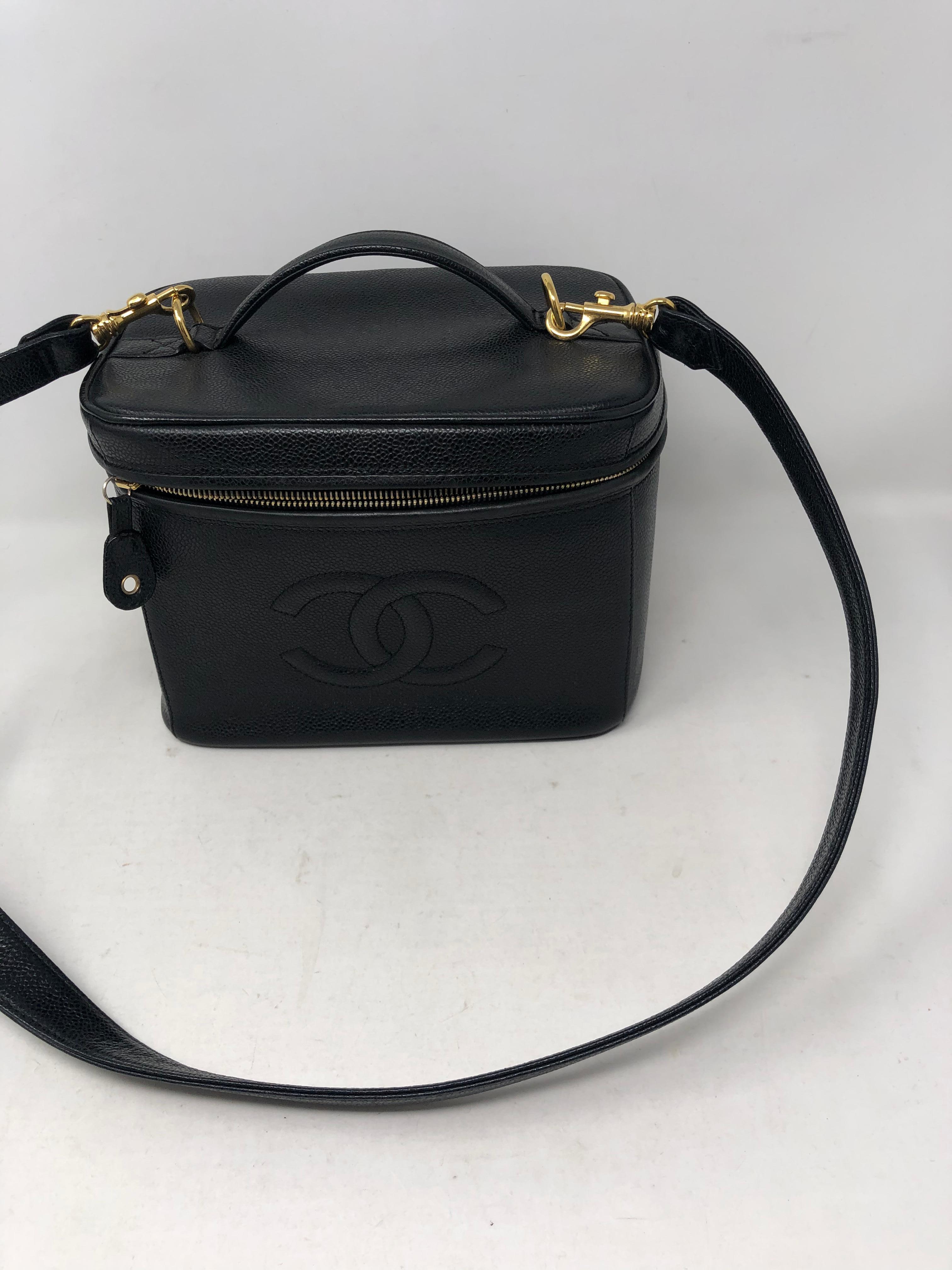 Chanel Vintage Vanity Case with Black Leather Strap. Caviar leather. Gold hardware. Excellent condition. Rare vintage piece. Includes authenticity card. Can be worn as a purse or as a crossbody bag. Don't miss out on this one. Guaranteed authentic. 