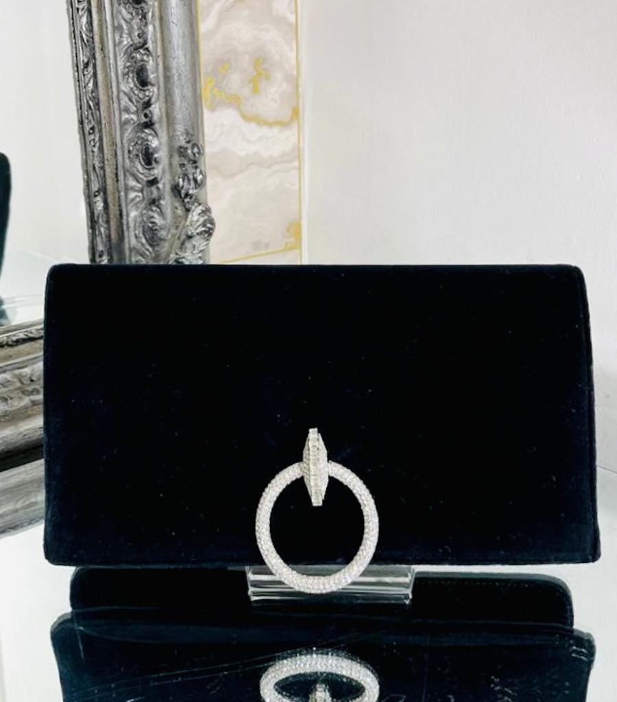 Chanel Velvet & Crystal Clutch Bag

Large sparkling crytal hoop style detail to the front of this black 

velvet rare bag. Zipper compartment with visible dangle 'CC'

logo to the side of the bag. Iconic diamond stitch to the interior.

From 2016