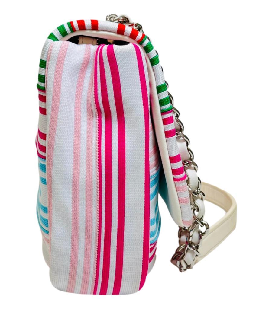 Chanel Venise Biarritz Canvas Flap Bag

White bag designed with multicoloured stripe pattern and detailed 'CC' logo, 'Chanel', 'Biarritz', and 'Deauville' inscriptions to front and rear.

Styled with signature 'CC' twist lock closure and leather and