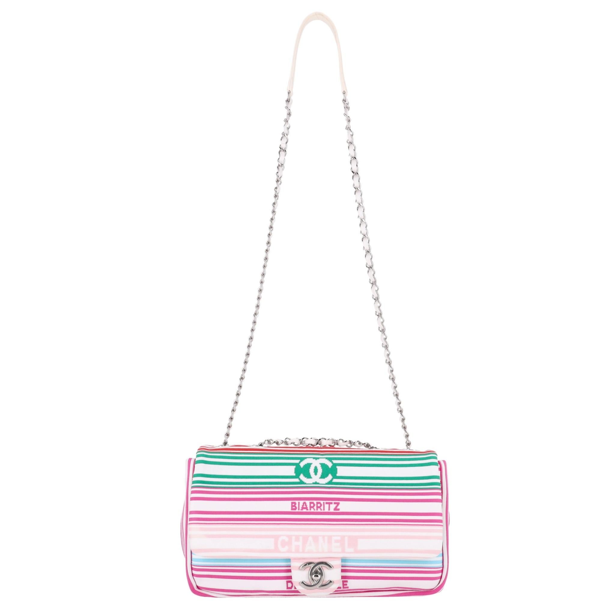 Chanel Venise Biarritz Canvas Flap Bag

White bag designed with multicoloured stripe pattern and detailed with 'CC' logo, 'Chanel', 'Biarritz', and 'Deauville' inscriptions to front and rear.

Styled with signature 'CC' twist lock closure and