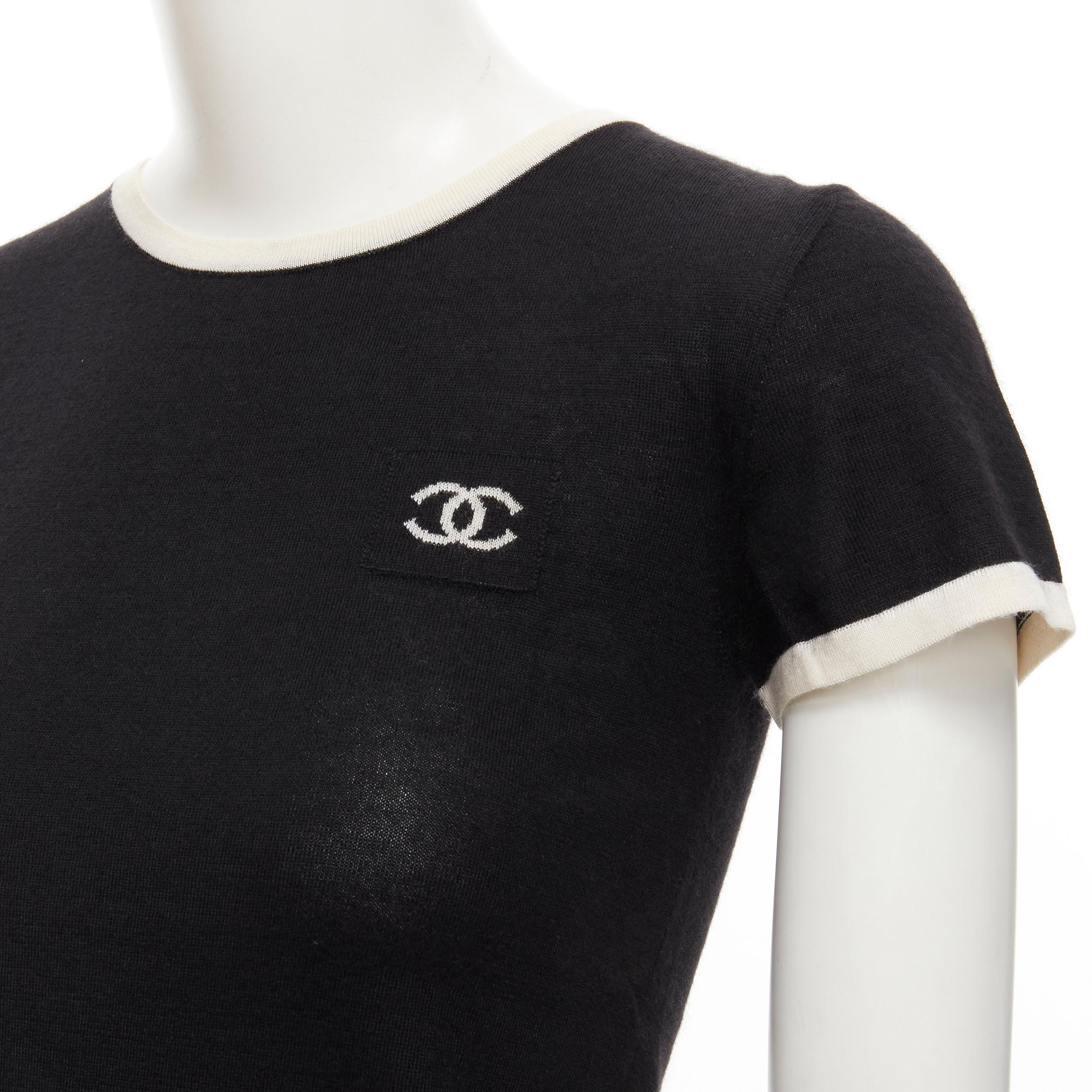 CHANEL Vintage 06C cashmere silk black white CC double pocket knit top FR34 XS 
Reference: LNKO/A01948 
Brand: Chanel 
Designer: Karl Lagerfeld 
Collection: 06C 
Material: Cashmere 
Color: Black 
Pattern: Solid 
Extra Detail: White trim. Double