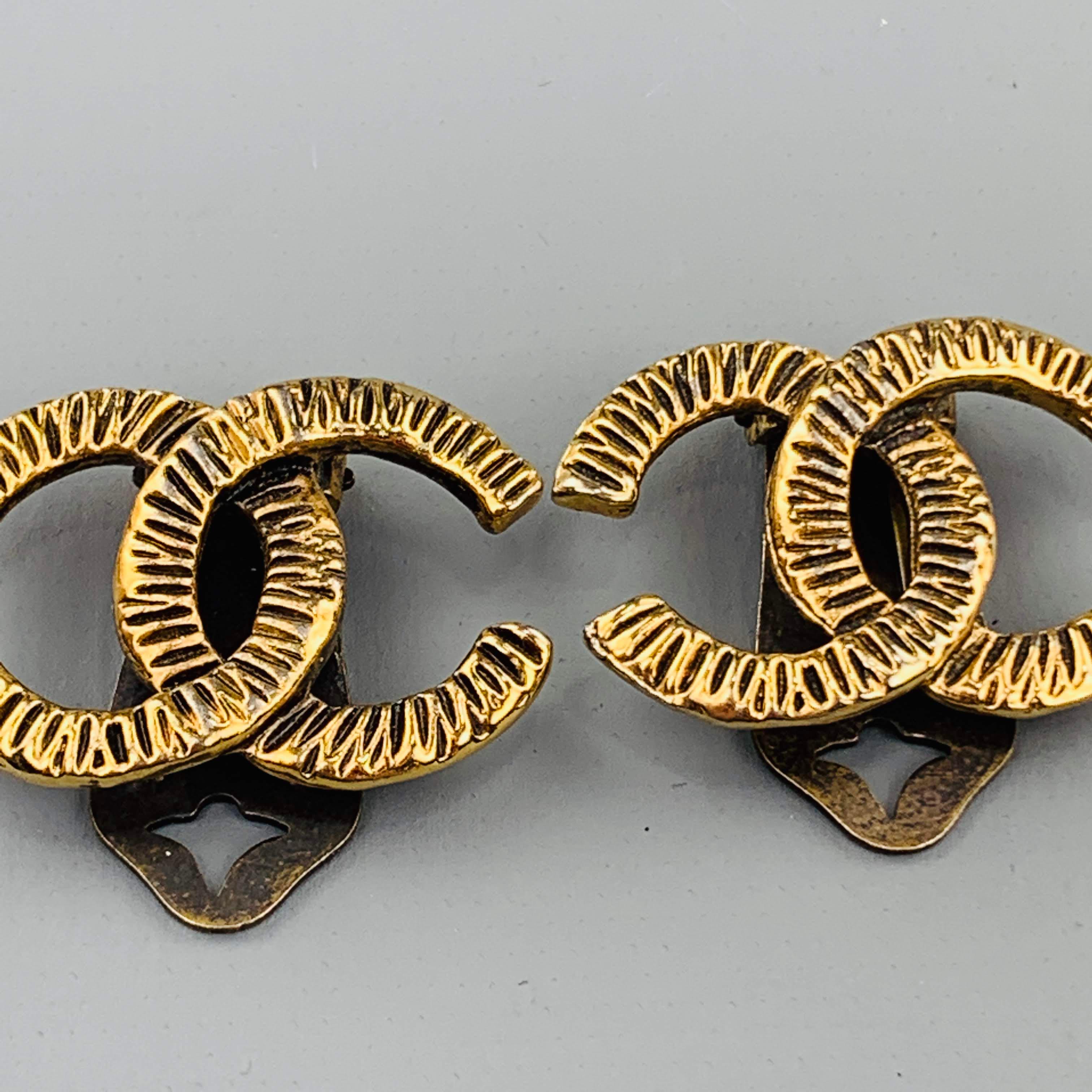 Rare vintage CHANEL clip on earrings circa 1950's come in antique gold tone metal with a classic textured CC cutout logo. Wear with age. As-is.
 
Good Pre-Owned Condition.
Marked: (no markings. Circa 1950's)
 
3 x 2 cm.