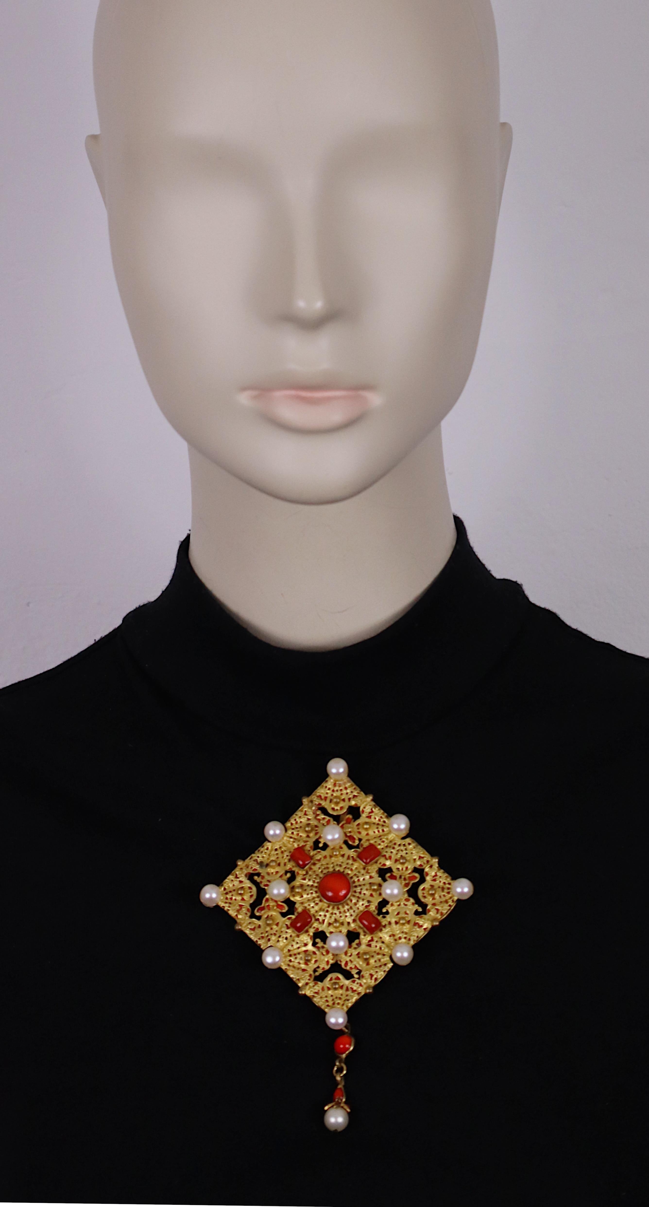 CHANEL vintage massive intricate filigree gold tone diamond shaped brooch/pendant embellished with poured coral color enamel and faux pearls.

Embossed CHANEL Made in France.

Indicative measurements : max. total height approx. 12.6 cm (4.96 inches)