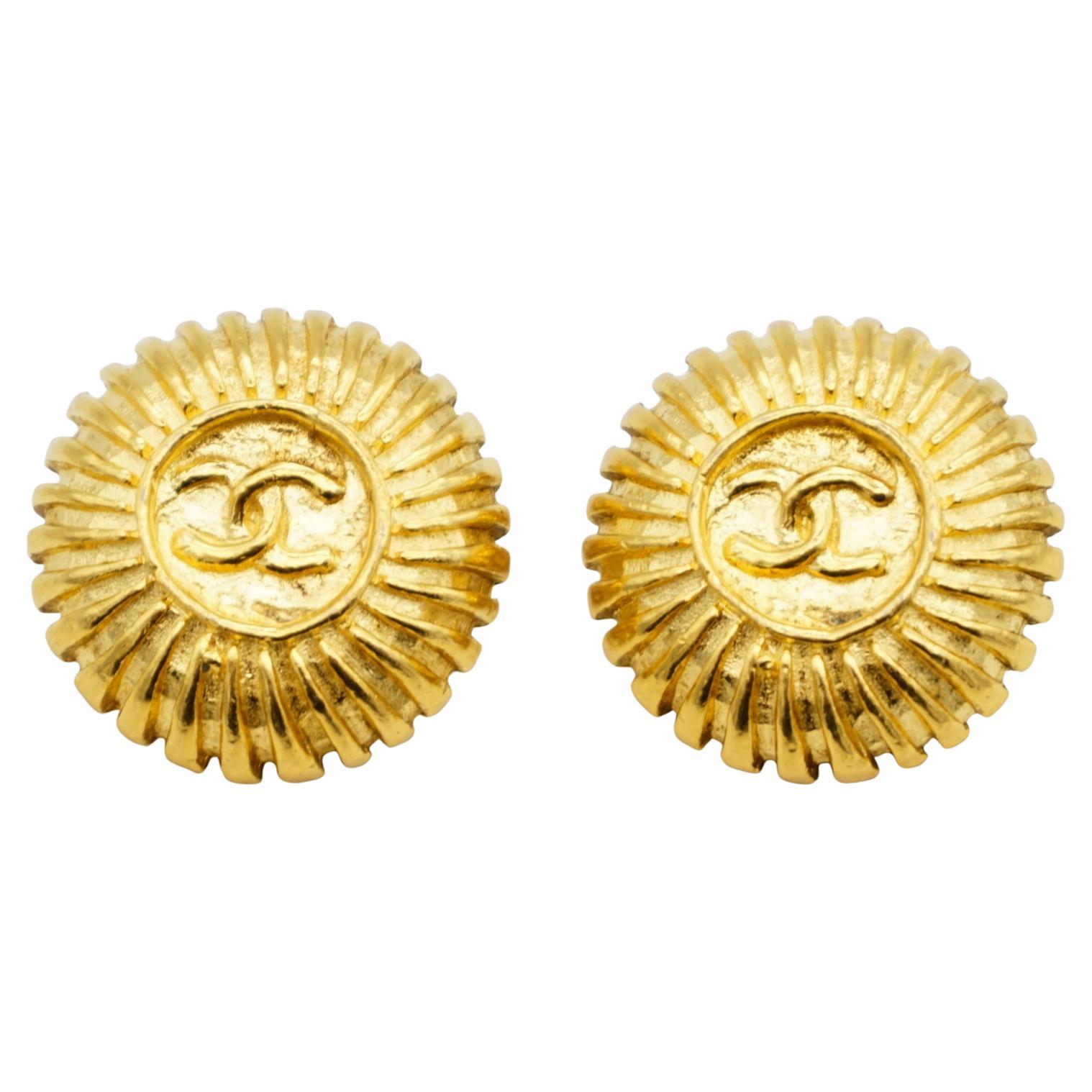 Chanel Vintage 1970s Textured Logo CC Coco Circle Round Sunburst Clip Earrings For Sale