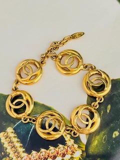 Chanel Vintage 1983 Logo CC Coco Six Openwork Interlocked Linked Gold Bracelet