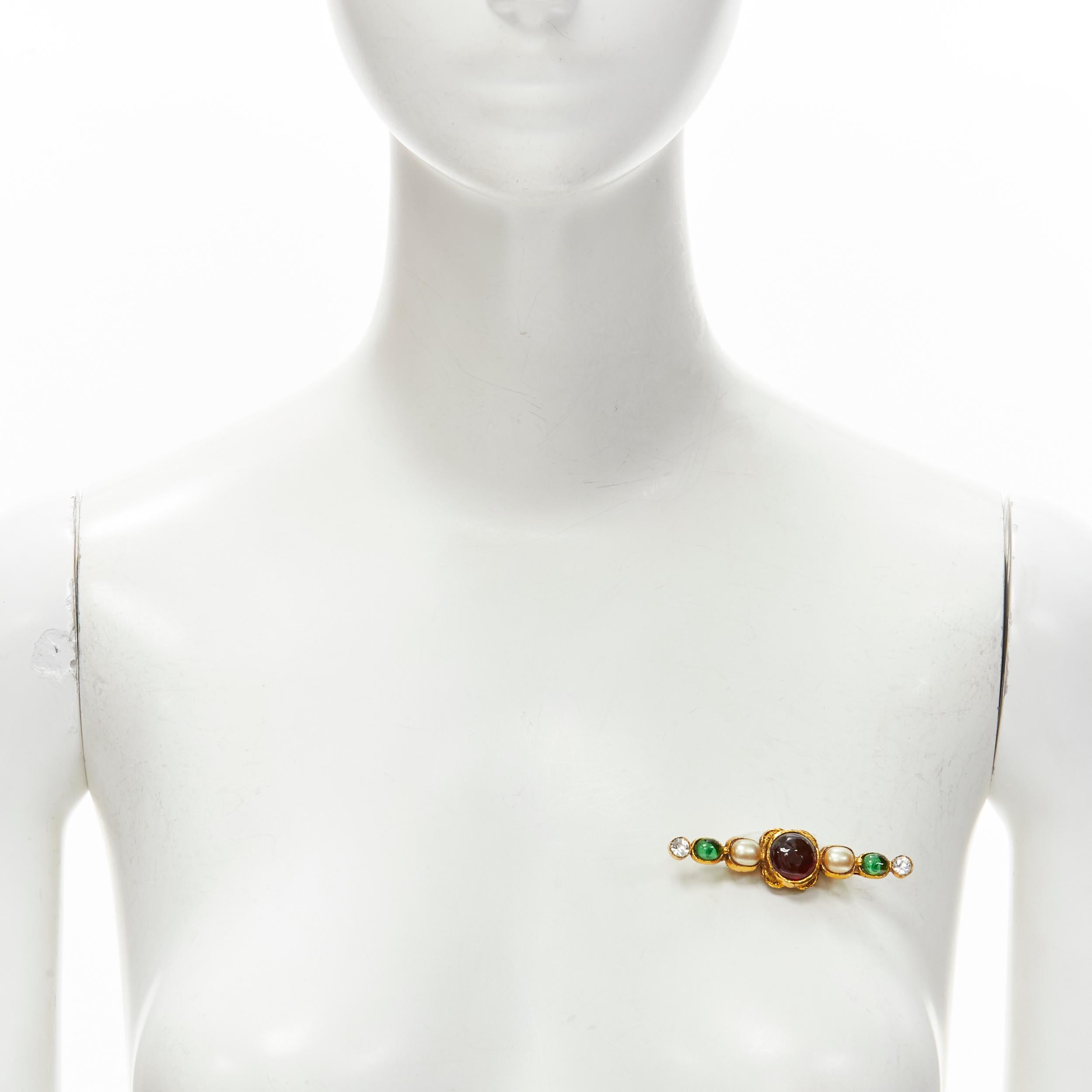 CHANEL Vintage 1985 gold gripoix pearl crystal jewel pin brooch
Brand: Chanel
Designer: Karl Lagerfeld
Collection: 1985 
Material: Metal
Color: Gold
Closure: Pin

CONDITION:
Condition: Excellent, this item was pre-owned and is in excellent