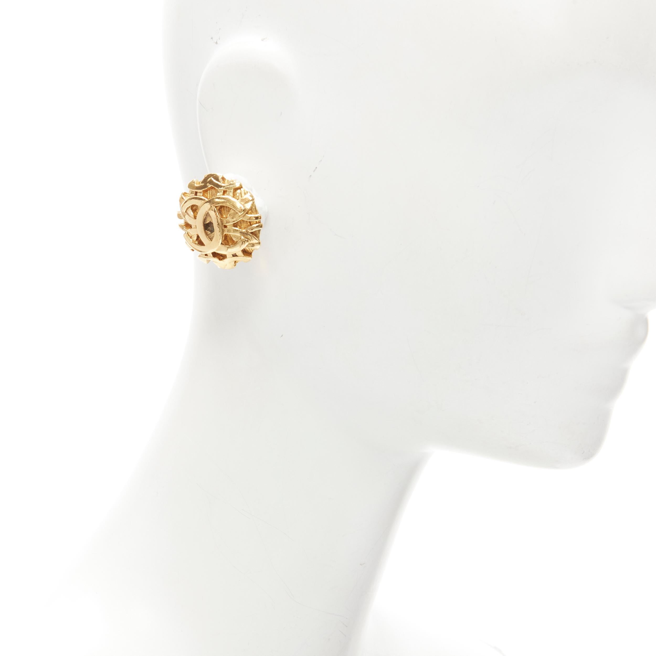 CHANEL Vintage 1990's 93A gold-tone CC lattice pattern medallion clip earrings
Brand: Chanel
Designer: Karl Lagerfeld
Collection: 93A 
Material: Metal
Color: Gold
Pattern: Solid
Closure: Clip On
Made in: France

CONDITION:
Condition: Excellent, this