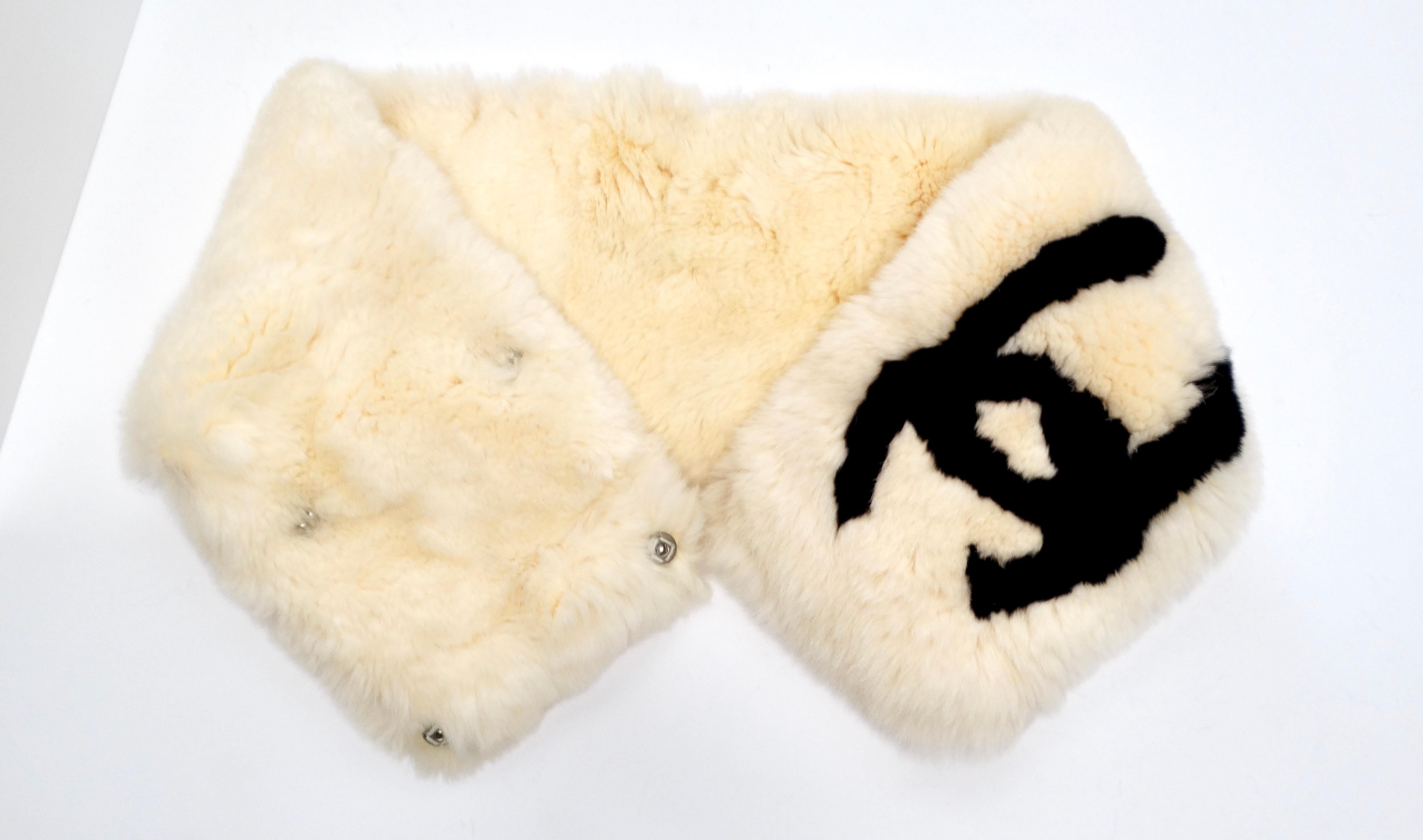 The Chanel Vintage 1990s CC Lapin Fur Cream & Black Muffler is a luxurious accessory that combines fun and sophistication in a timeless piece. Crafted from sumptuous lapin fur, this stunning muffler features a prominent black CC logo against a soft