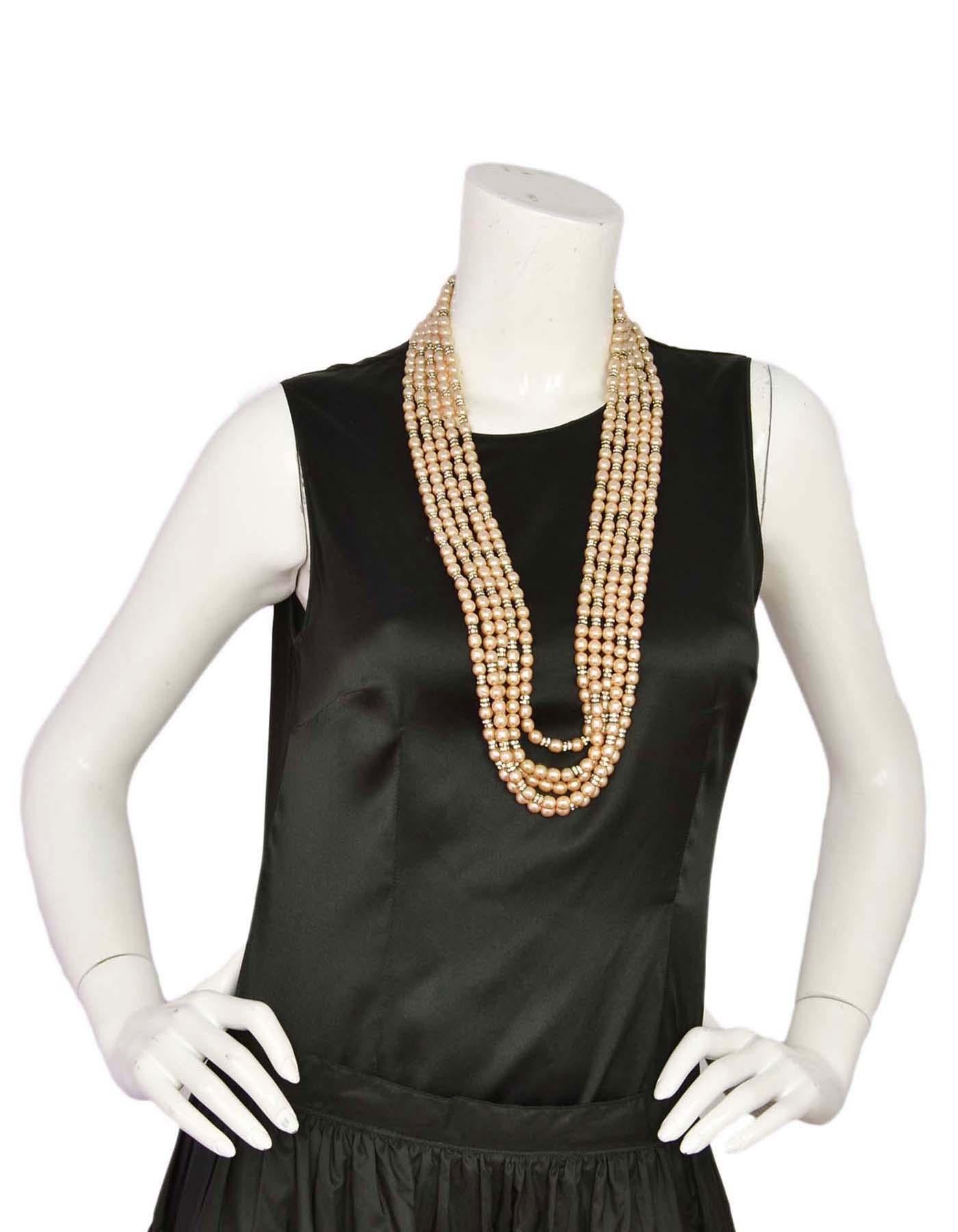 Chanel Vintage '90s Multi-Strand Pearl & Crystal Rondelle Necklace

Made In: France
Year of Production: 1990-1992
Color: Ivory and goldtone
Materials: Faux pearls, metal and rhinestones
Closure: Hook closure
Stamp: Chanel CC Made in France
Overall
