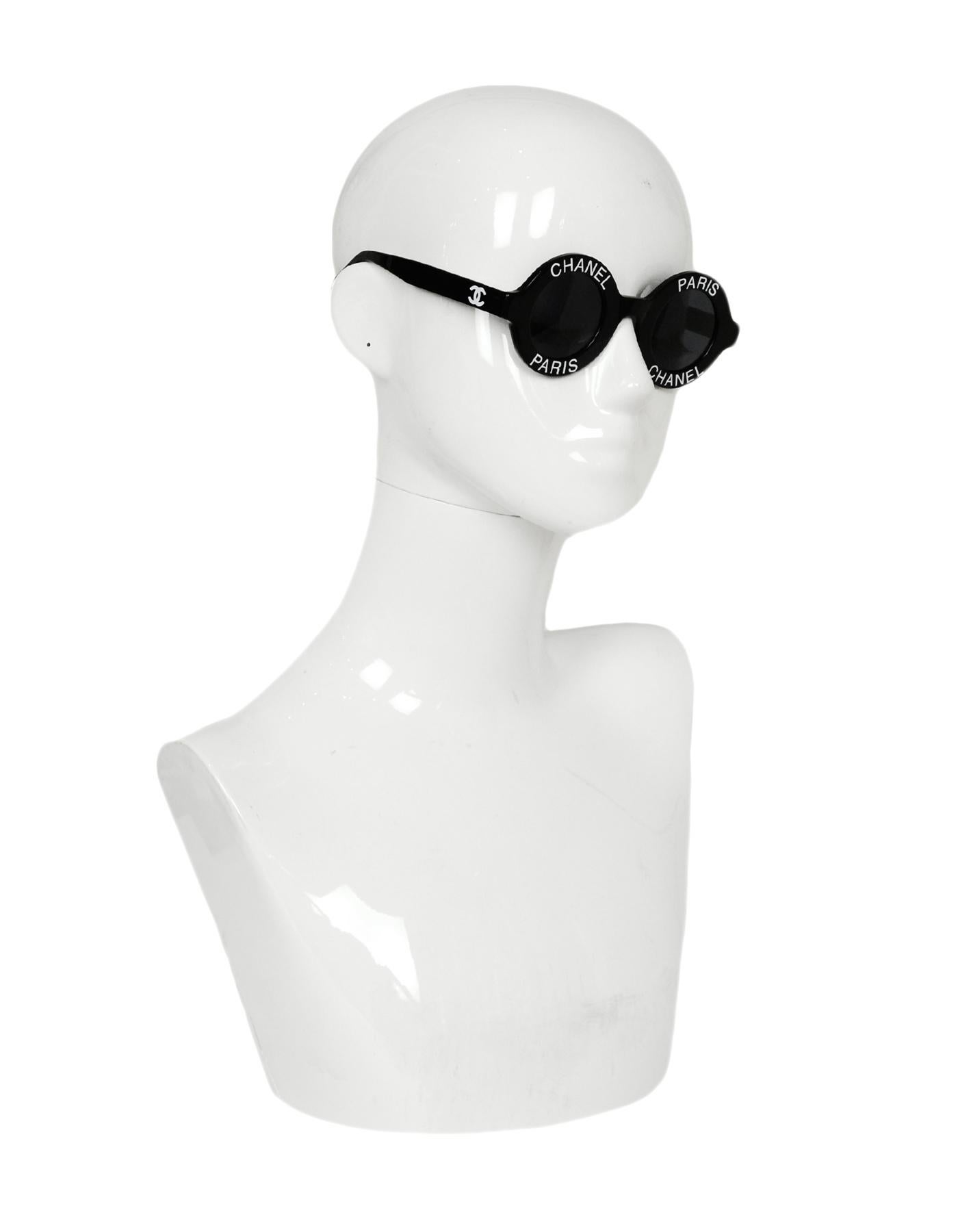 Chanel Black Resin Round Frame Sunglasses w/ Chanel Paris

Made In: Italy
Year of Production: 1993
Color: Black with white lettering
Hardware: Goldtone
Materials: Resin
Overall Condition: Excellent pre-owned condition with the exception of light