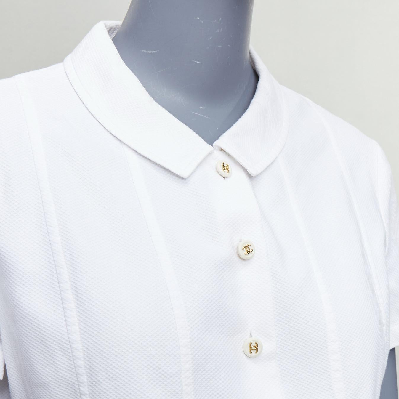CHANEL Vintage 1990's white cotton gold CC logo button panelled crop shirt
Reference: TGAS/E00382
Brand: Chanel
Designer: Karl Lagerfeld
Material: Cotton
Color: White, Gold
Pattern: Solid
Closure: Button
Extra Details: circa 1990-2000s. white