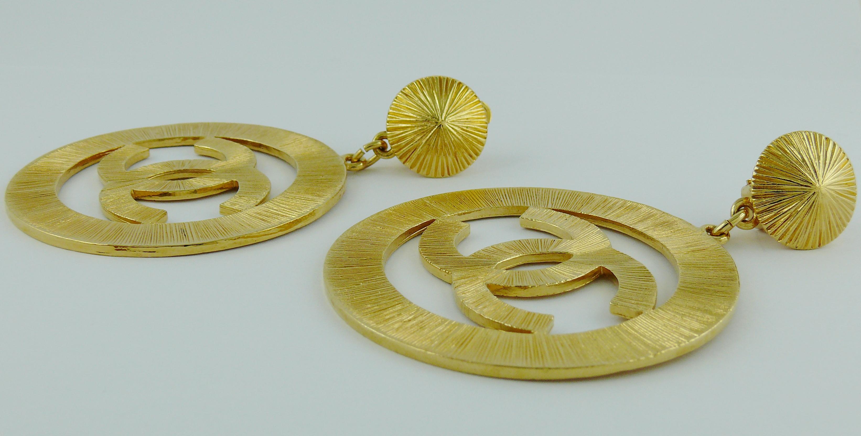 Women's Chanel Vintage 1992 Gold Toned Jumbo Sunburst Textured CC Logo Dangling Earrings