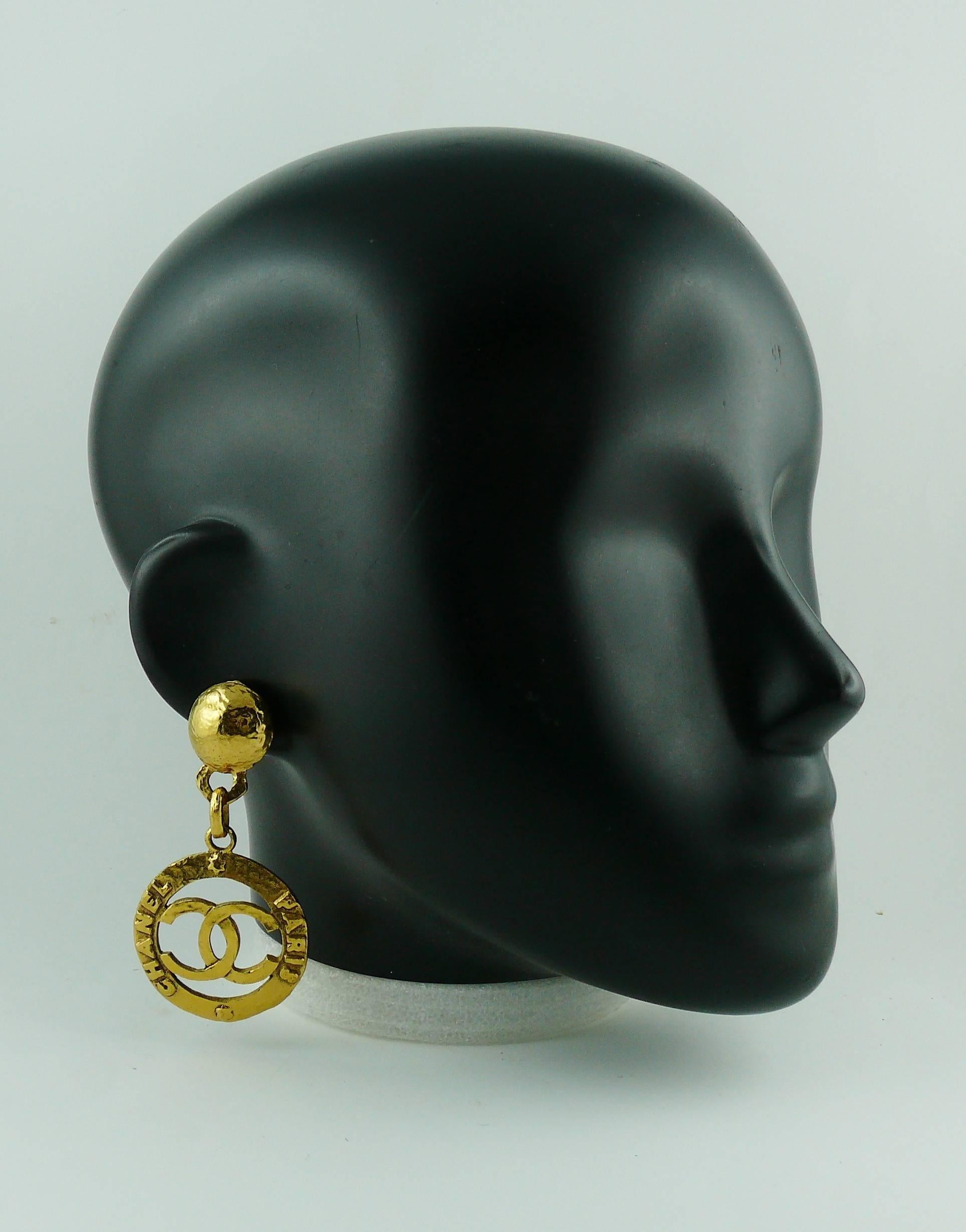 CHANEL vintage 1993 gold toned dangling earrings (clip-on) featuring a large CC monogram and 