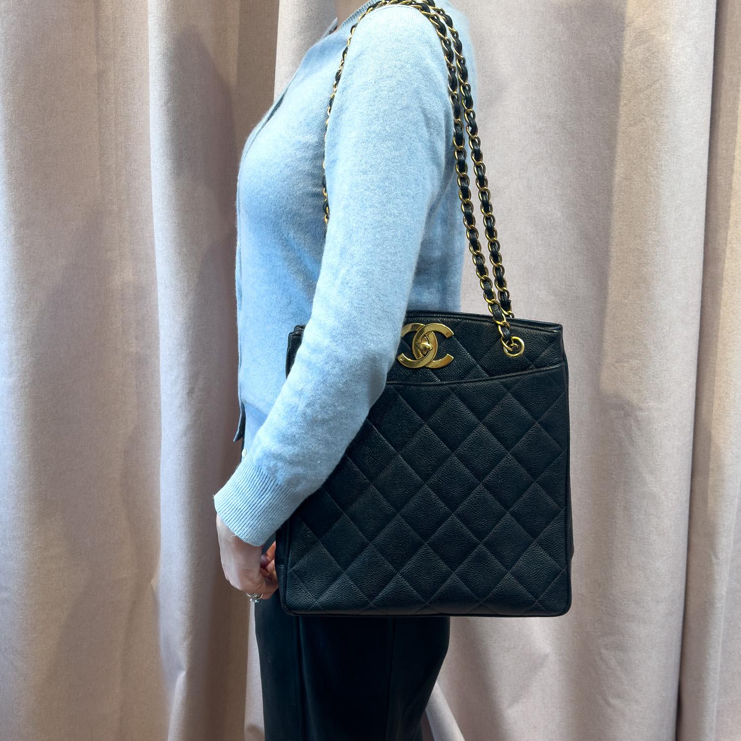 Step back in time with the exquisite Chanel Vintage Black Caviar Shoulder Tote, a must-have for connoisseurs of classic style and timeless craftsmanship. Dating back to the golden era of the mid-1990s, this iconic piece represents the pinnacle of