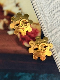Chanel Vintage 1994 Engraved Snowflake Logo CC Coco Flower Openwork Earrings