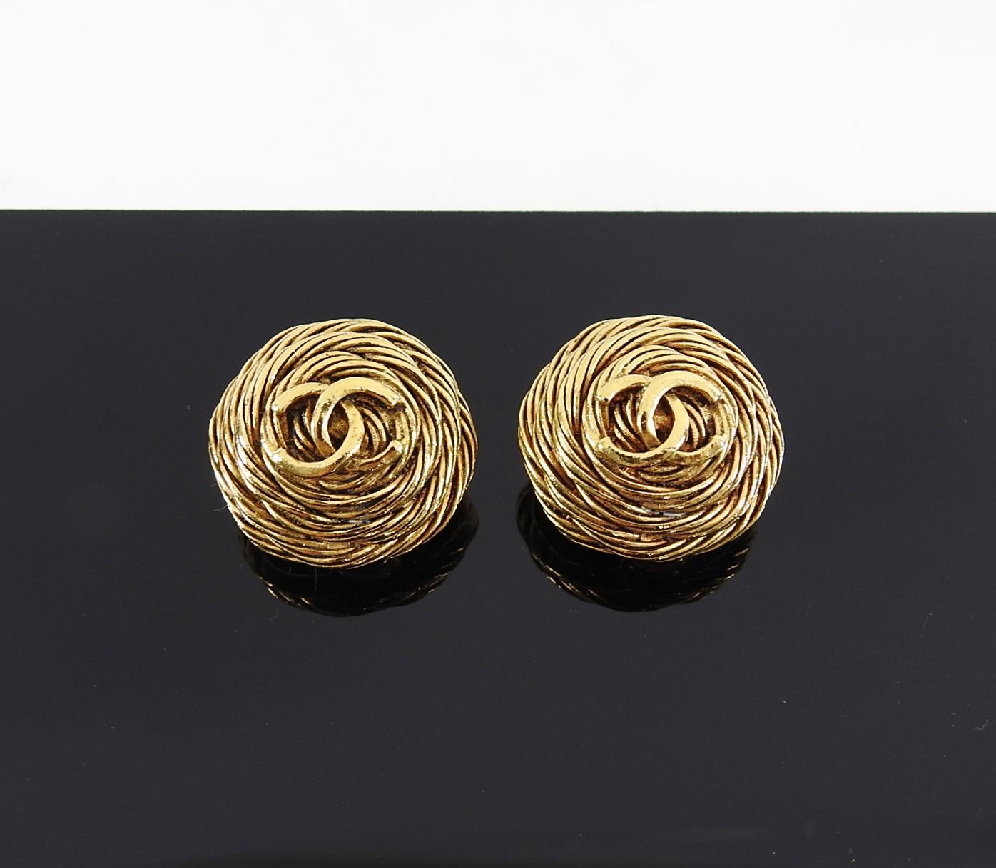Chanel Vintage 1994 Gold CC Round Clip Earrings.  From the 94A collection, clip on, goldtone metal with CC logo, and domed profile.  Excellent condition. Measures 1-⅛” across.