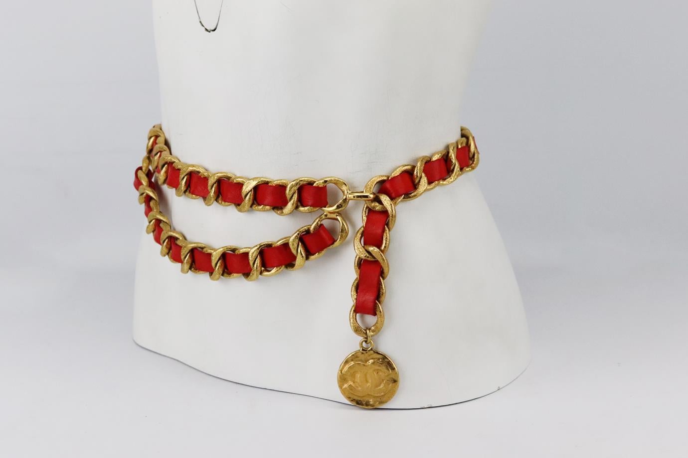 Chanel Vintage 1994 leather trimmed chain waist belt. Made from soft red leather interlinked with a mottled thick gold-tone chain and medallion detail at the front. Red. Hook fastening at front. Size: L: 38 in. Width: 1 in