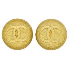Chanel Vintage 1994 Texture Logo CC Coco Relief Circle Round Medallion Earrings
