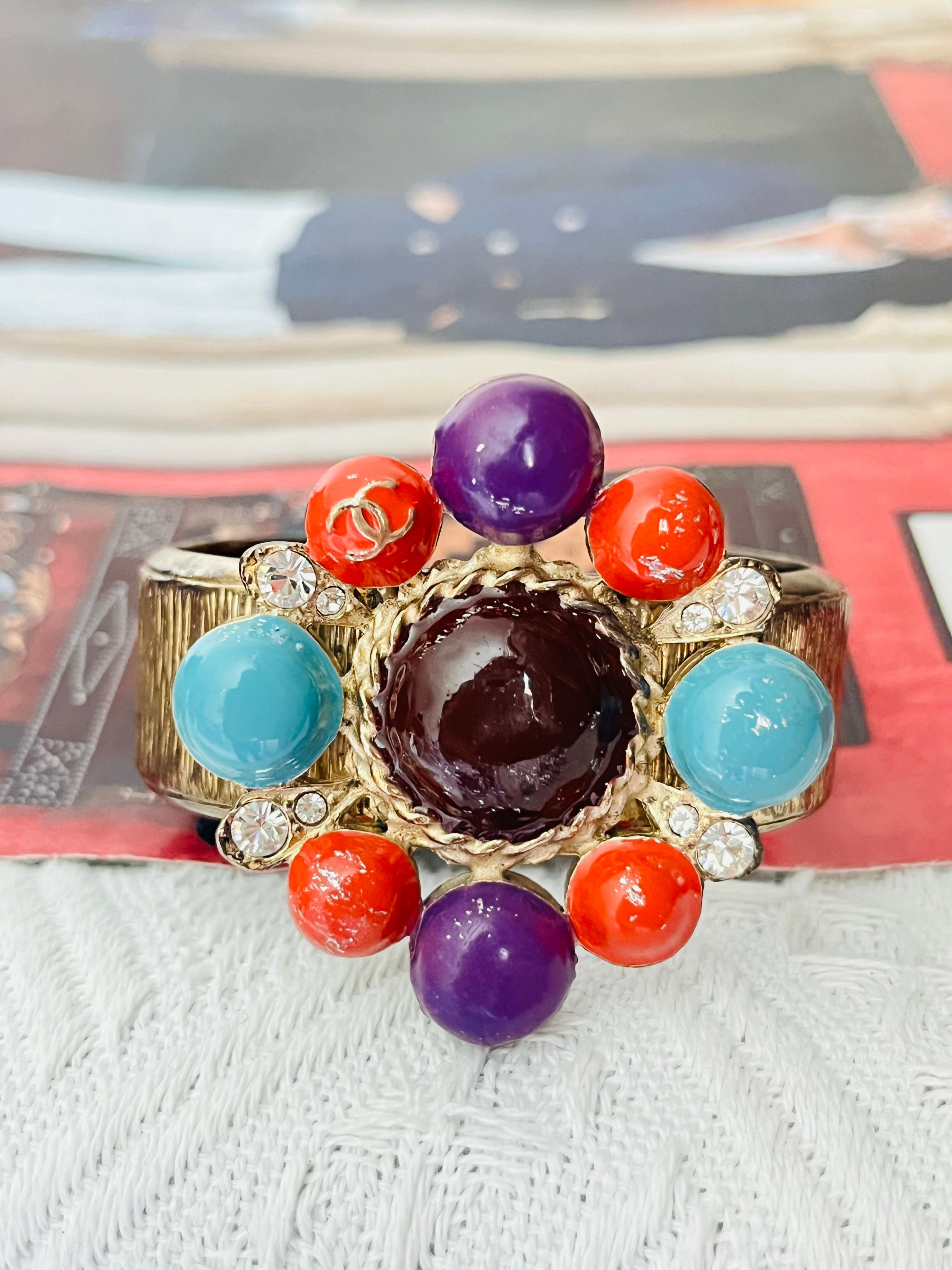 Chanel Vintage 1997 Maltese Cross CC Logo Crystals Turquoise Red Purple Brown Cabochon Pendant Charm Chunky Modernist Cuff Bangle Bracelet

Very good condition. Light scratches or colour loss. 100% Genuine. 

Marked at back. Rare to find.

Material: