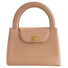 Chanel Vintage 1998 Kelly Borsa a manico superiore in pelle d'agnello rosa nuda e oro 24 carati