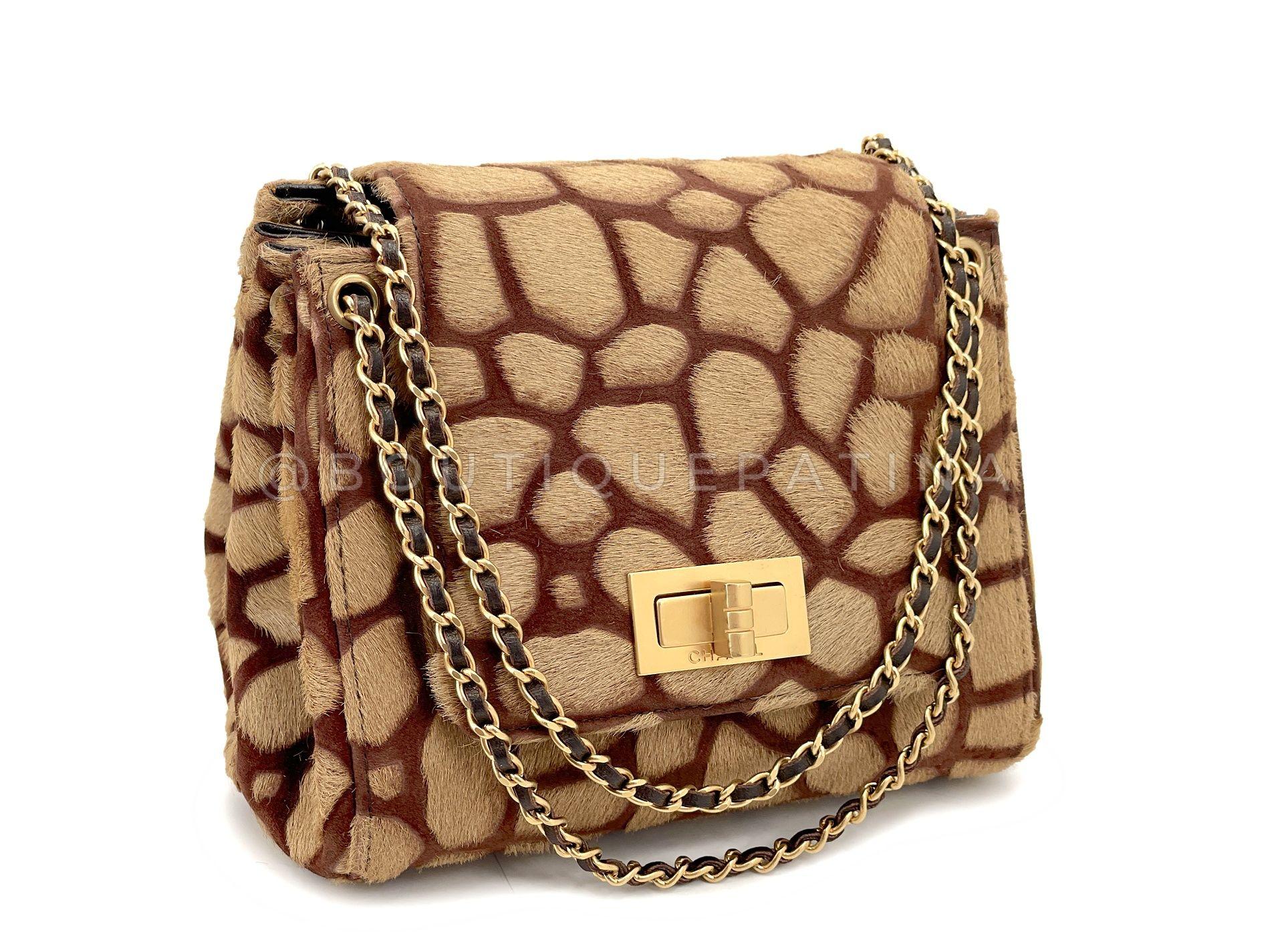 Store item: 68209
A rare collectible, this Chanel Vintage 2000 Pony Hair Small-Mini Beige Giraffe Accordion Flap Bag GHW comes in this mini-small size that can be worn as an evening bag or clutch.

In luxurious camel beige pony hair and chocolate