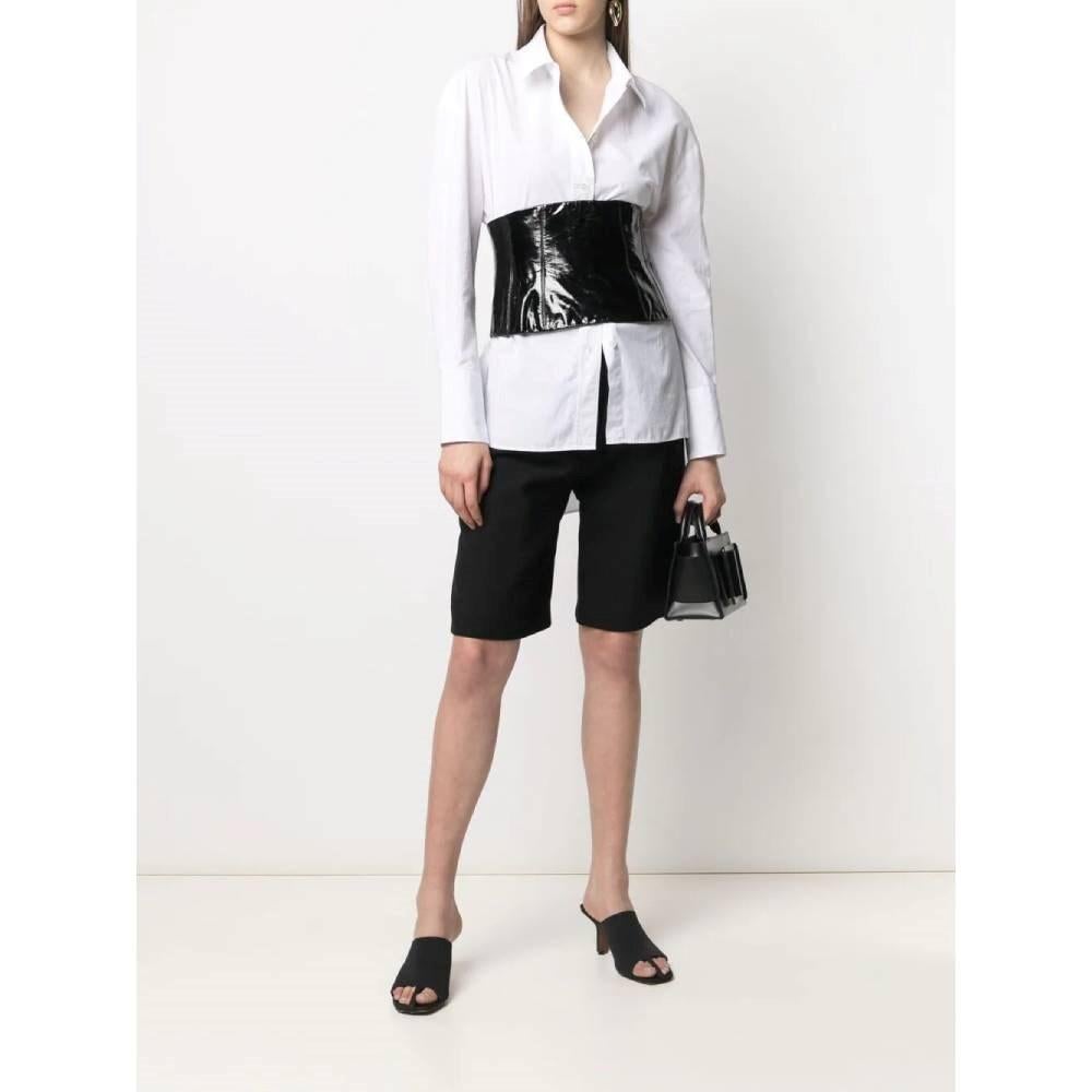 Chanel 2000s black patent leather bustier top. Crop model, with high-shine finishing and rear zip fastening.

Size: 38 FR

Flat measurements
Height: 21 cm
Bust: 34,5 cm

Product code: A8064

Composition: Outer: 100% Lambskin
Lining: 100% Silk

Made