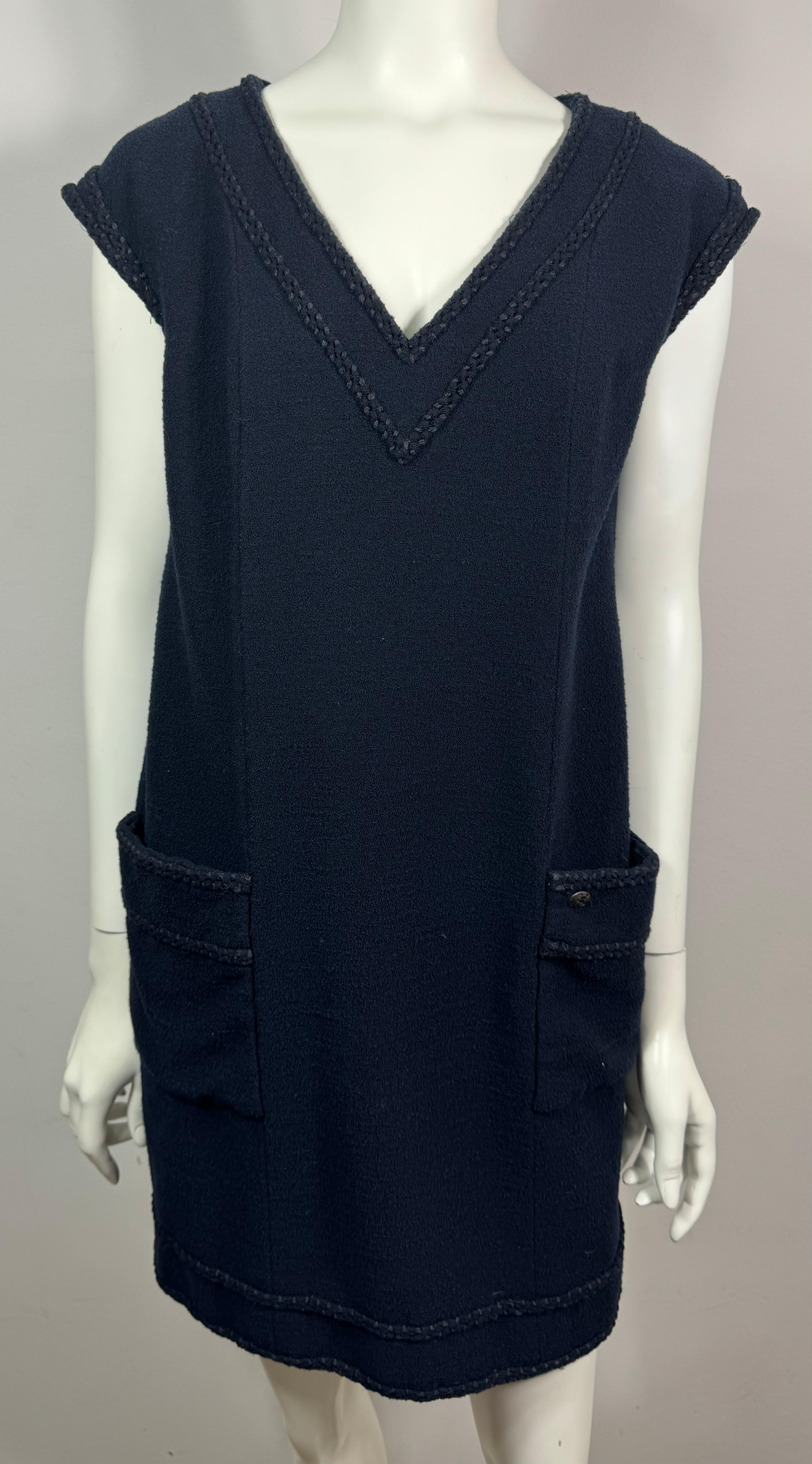 Chanel Vintage 2008 Cruise Navy Wool Shift Dress-Size 44  This classic Chanel look comes from the 2008 cruise collection under the design of Karl Lagerfeld. The Navy sleeveless dress has a V neckline, a two toned braided knit border/cording that