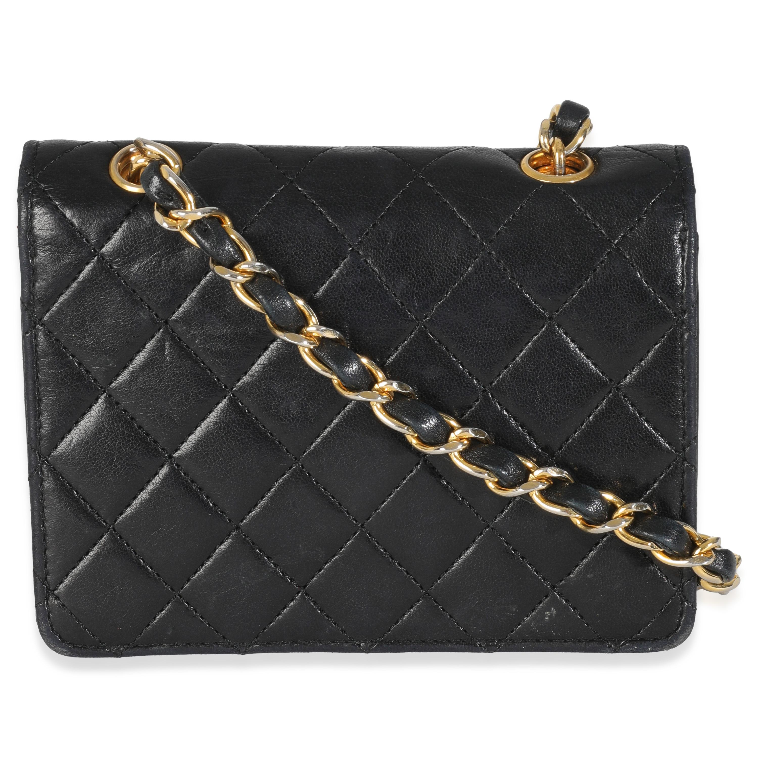 Listing Title: Chanel Vintage 24K Black Quilted Lambskin Extra Mini Flap Bag
SKU: 146615
Condition: Pre-owned 
Condition Description: A timeless classic that never goes out of style, the flap bag from Chanel dates back to 1955 and has seen a number