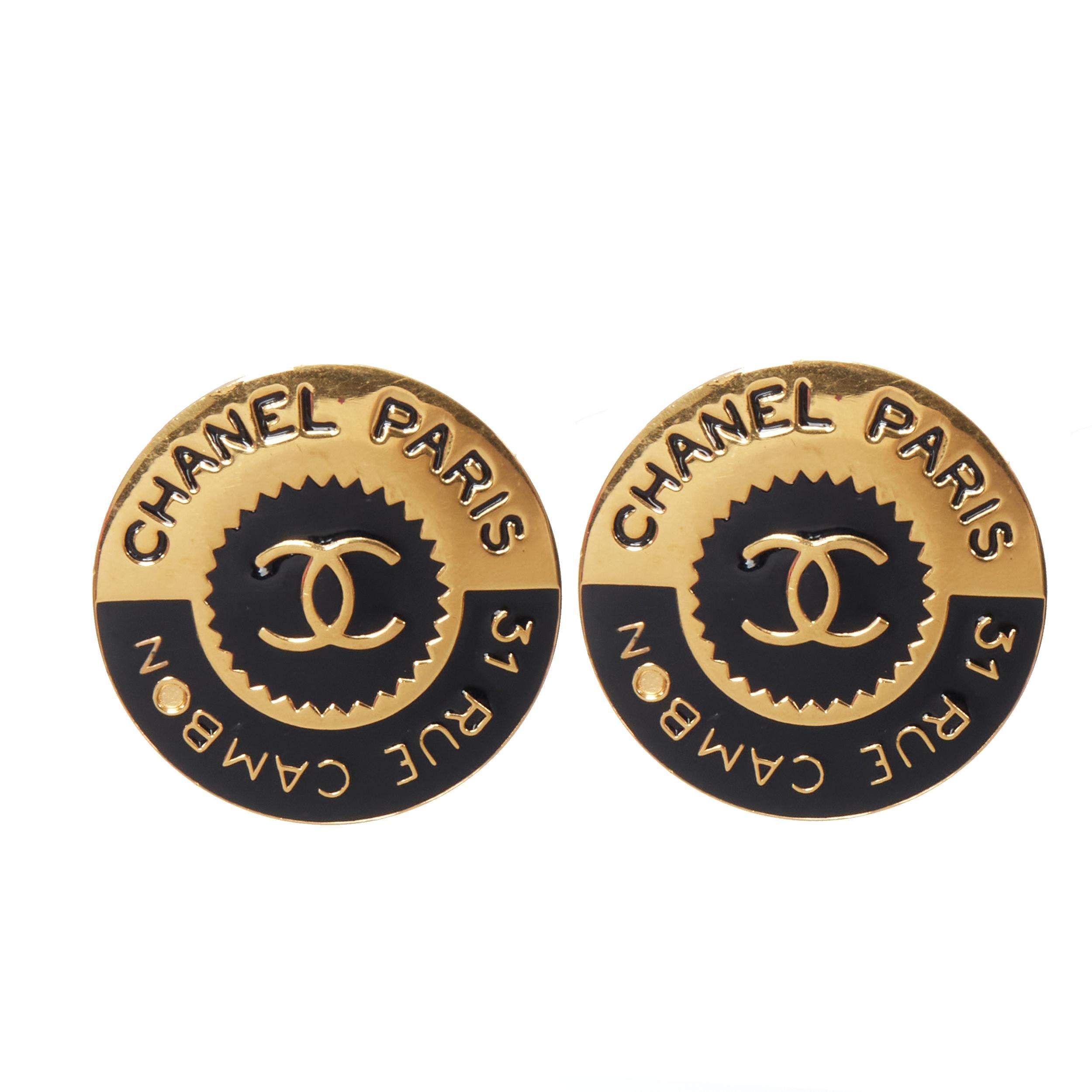 CHANEL Vintage 31 Rue Cambon logo stamp black gold statement disc earrings 
Reference: GIYG/A00232 
Brand: Chanel 
Designer: Karl Lagerfeld 
Material: Metal 
Color: Gold 
Pattern: Solid 
Closure: Clip on 
Extra Detail: CC 31 Rue Cambon logo.