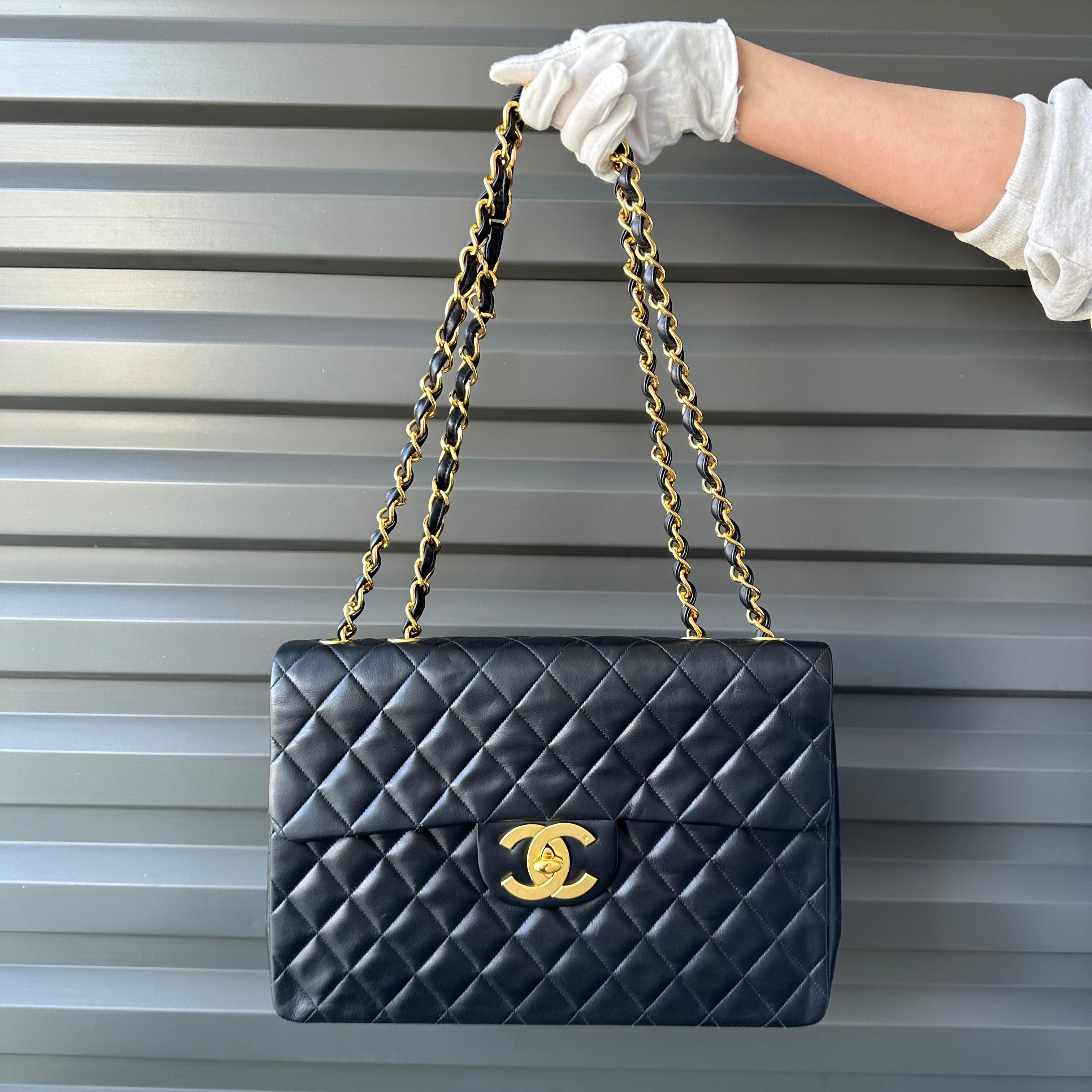 Description: This is a gorgeous Chanel Vintage Lambskin Quilted Leather Maxi Single Classic Flap XL featuring oversized 24 karat gold-plated CC logo hardware, black leather interwoven gold chain, burgundy lambskin interior lining with zipper and