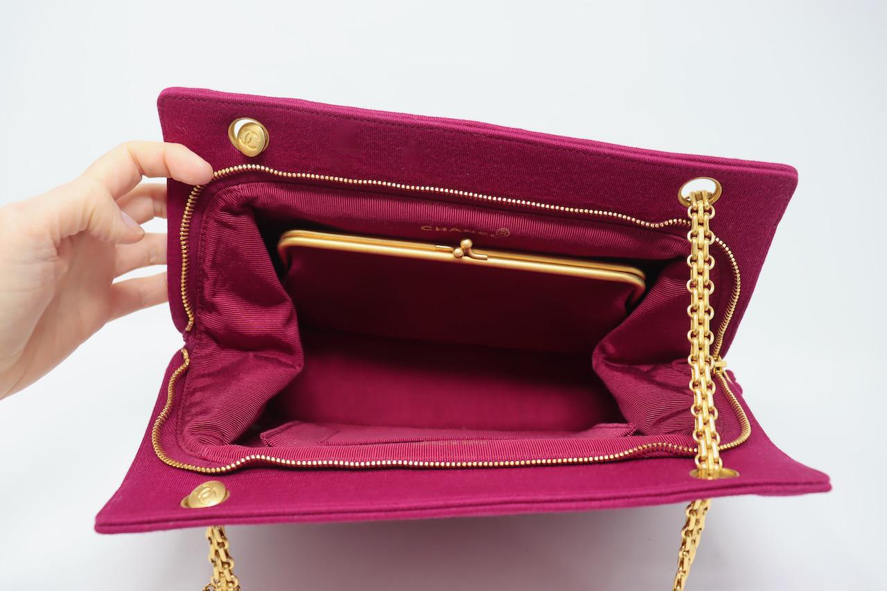 Vintage 90's CHANEL Magenta Jersey Bag With Gold Mademoiselle Chain Straps.  I love these Vintage Chanel bags so much.  This one is special because it has a unique quilting.  This piece has a removable coin purse inside as well!  This is a 3 series