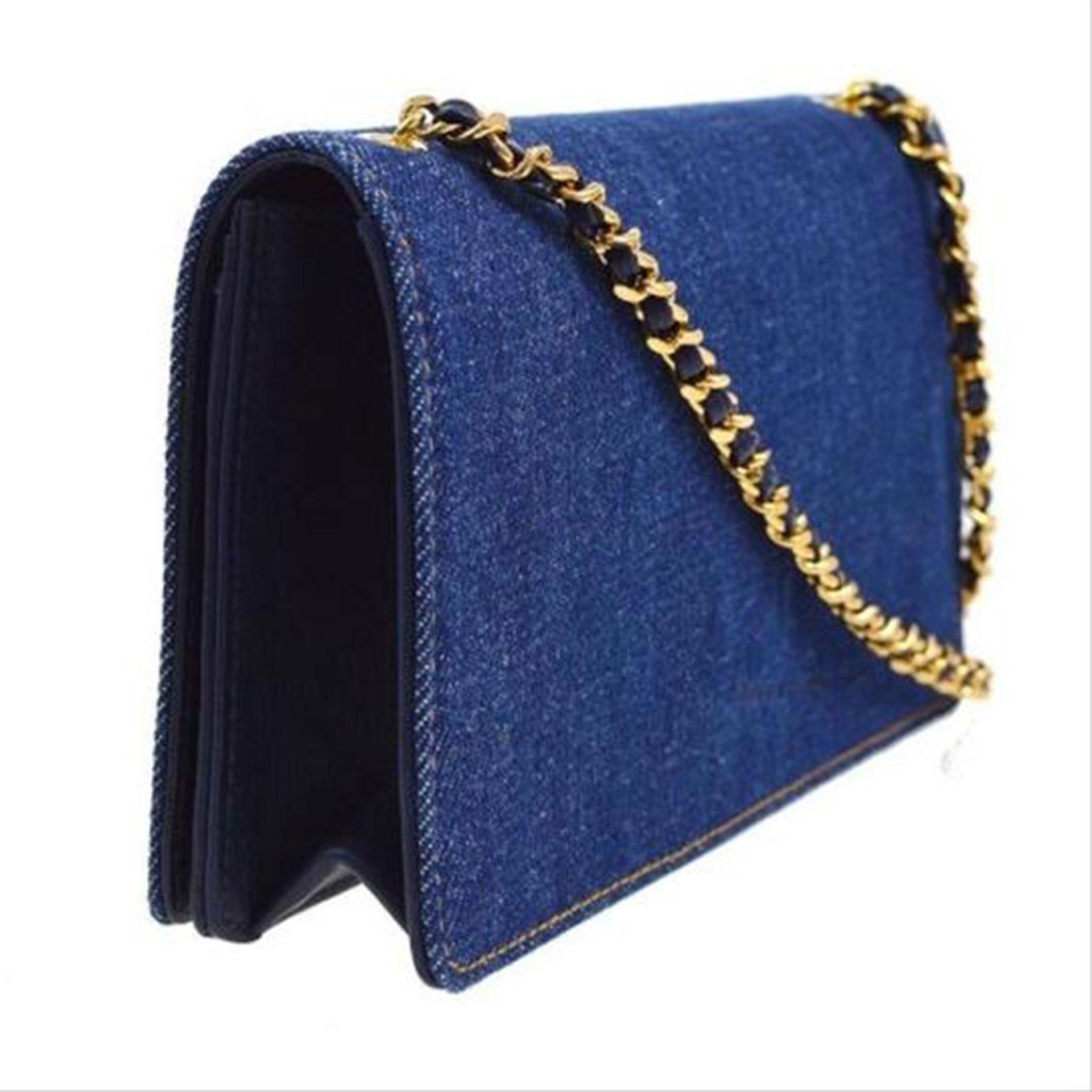 Chanel Rare Vintage 90's Denim WOC Wallet on a Chain 

1996 {VINTAGE 25 Years}

Gold hardware
Classic leather interwoven single chain
CC Stitched Logo at front
Navy leather interior lining
Three interior compartments
Single coin pouch, four card